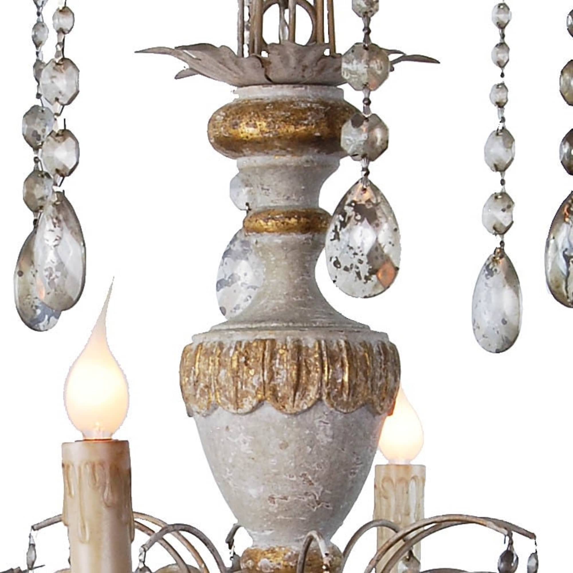 Ornate chandelier detail with crystal drops and faux candle lights