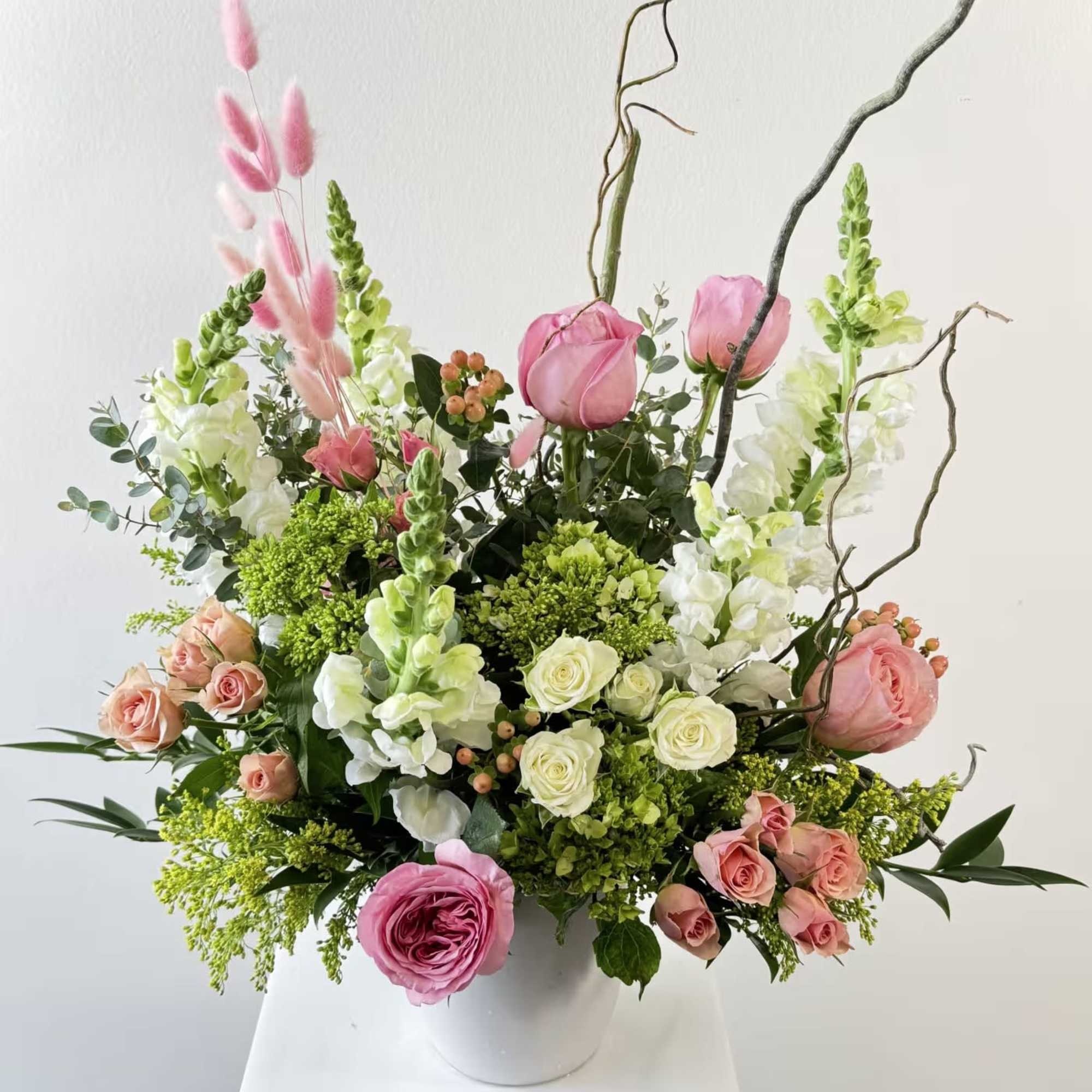 Discover the free-spirited charm of Boho Peach, a whimsical bohemian flower arrangement