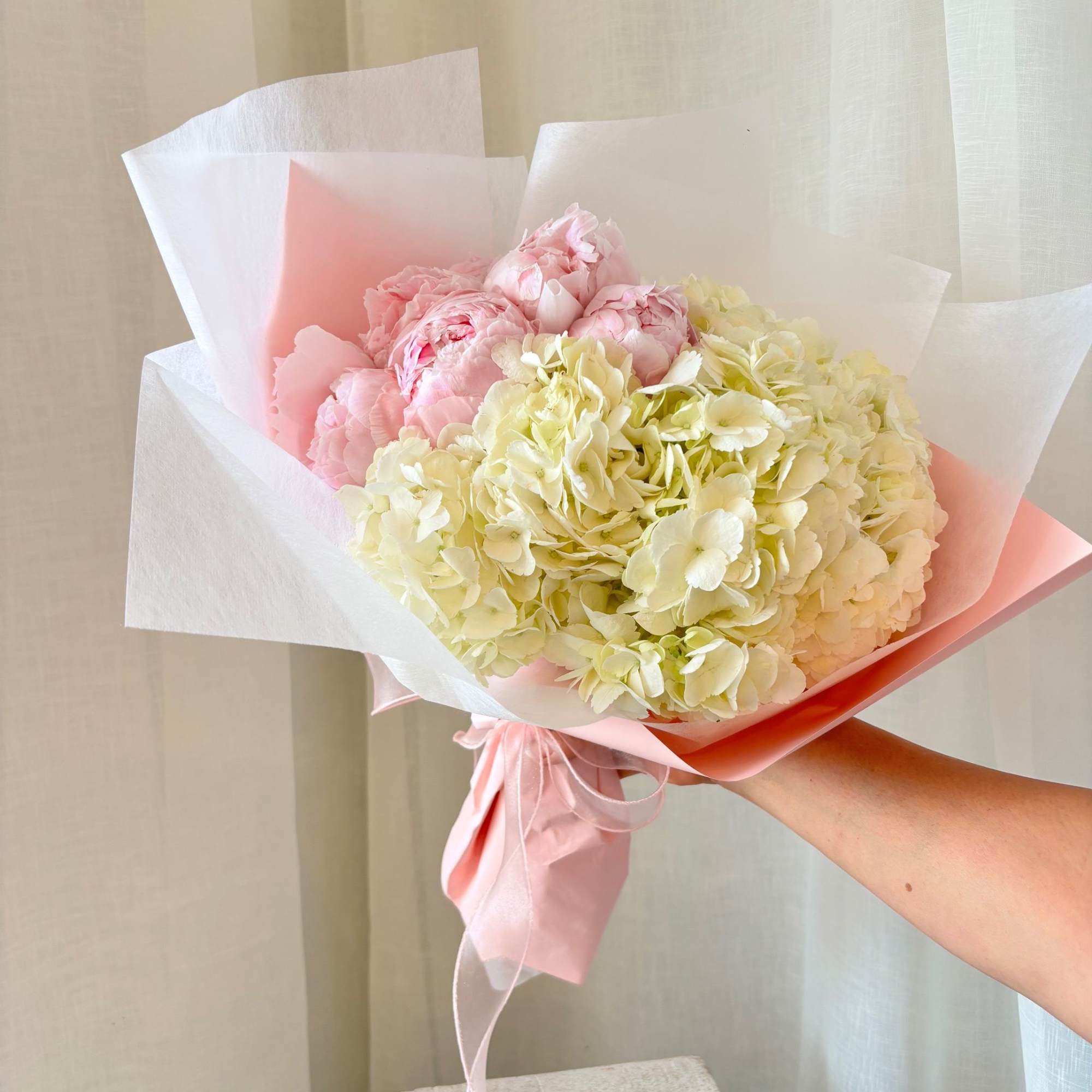 This simple yet impactful bouquet of 10 Peonies (standard) nestled in a, photo 2 of 3