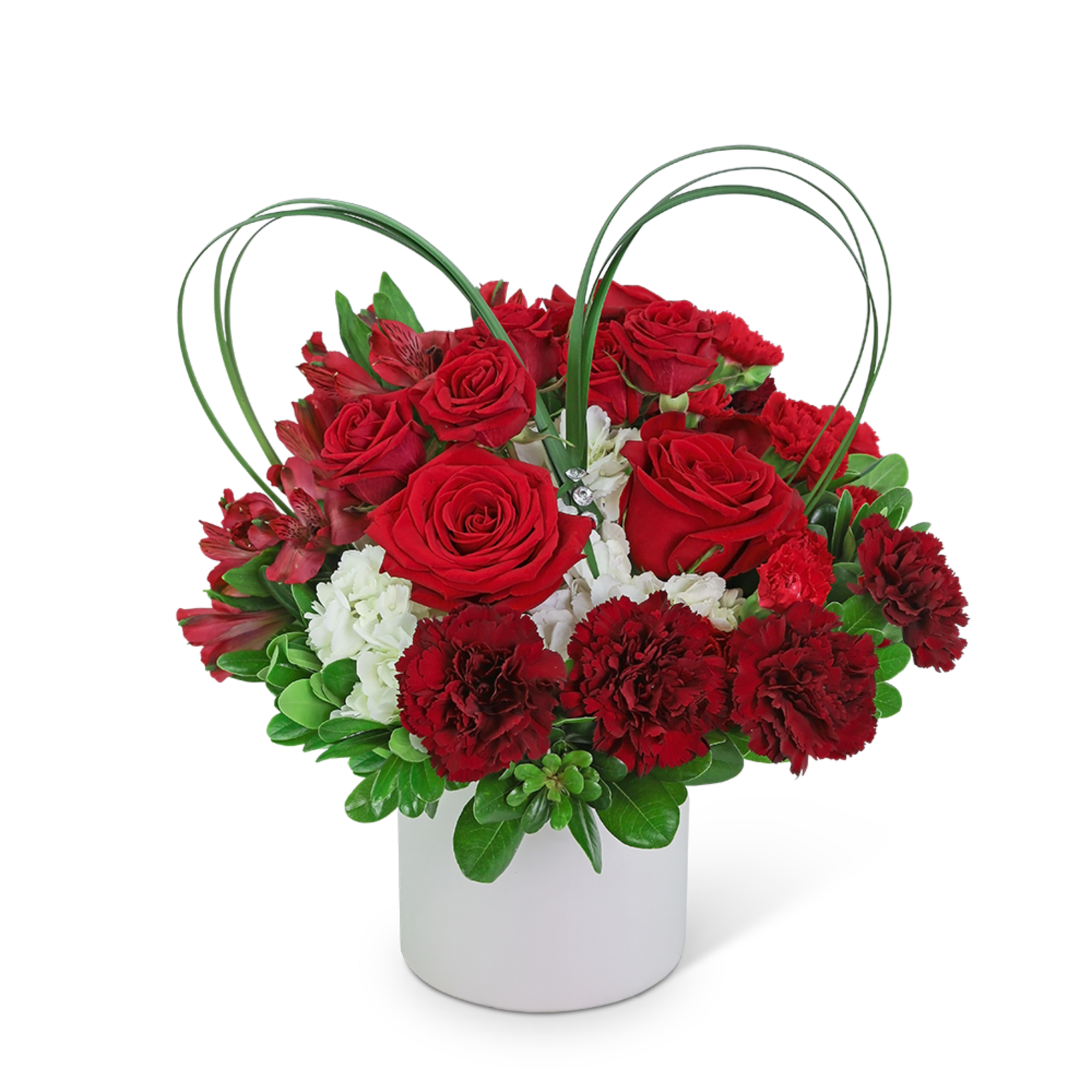 Red roses and carnations in a white vase with heart-shaped loops