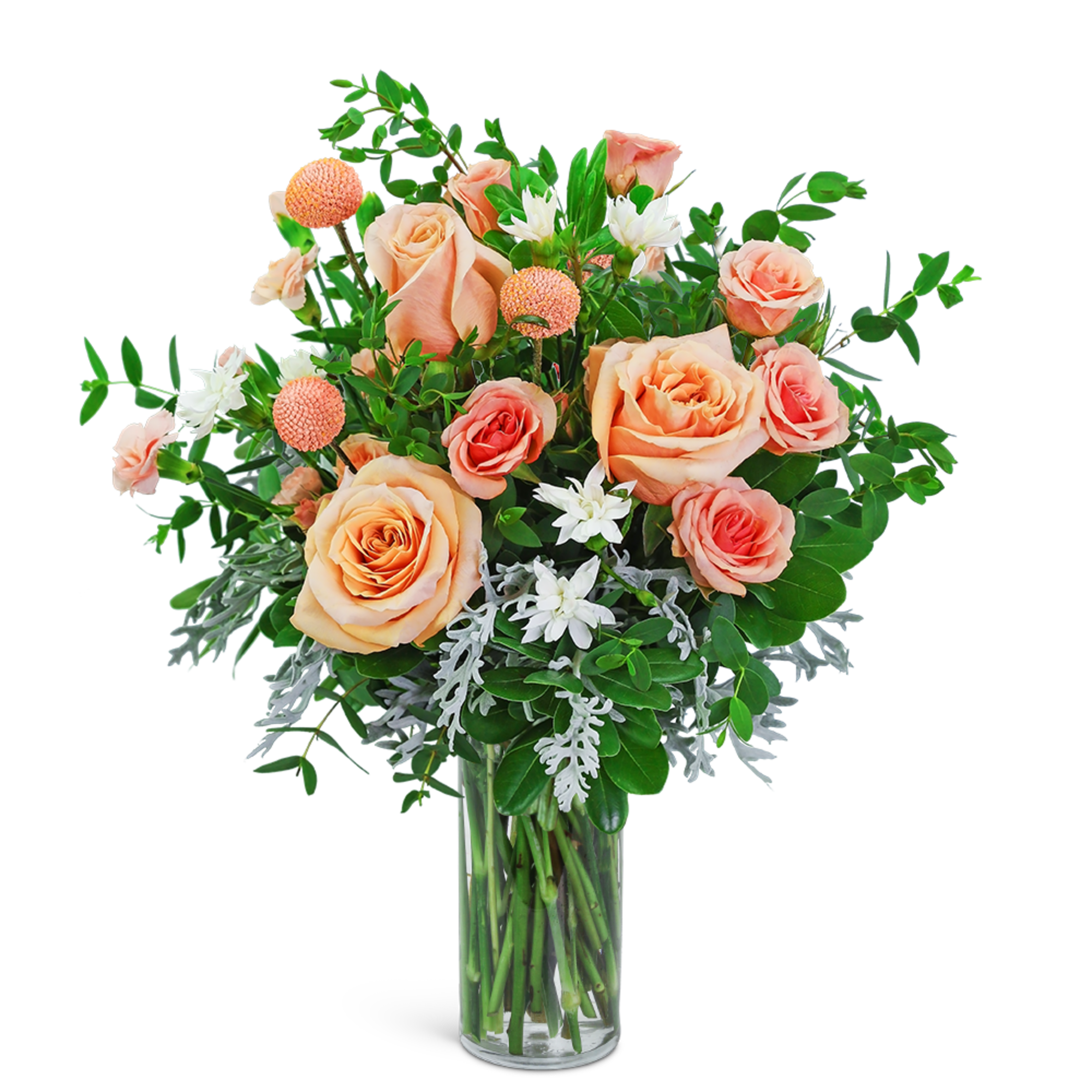 Peach and coral roses in a clear glass vase with white accent flowers