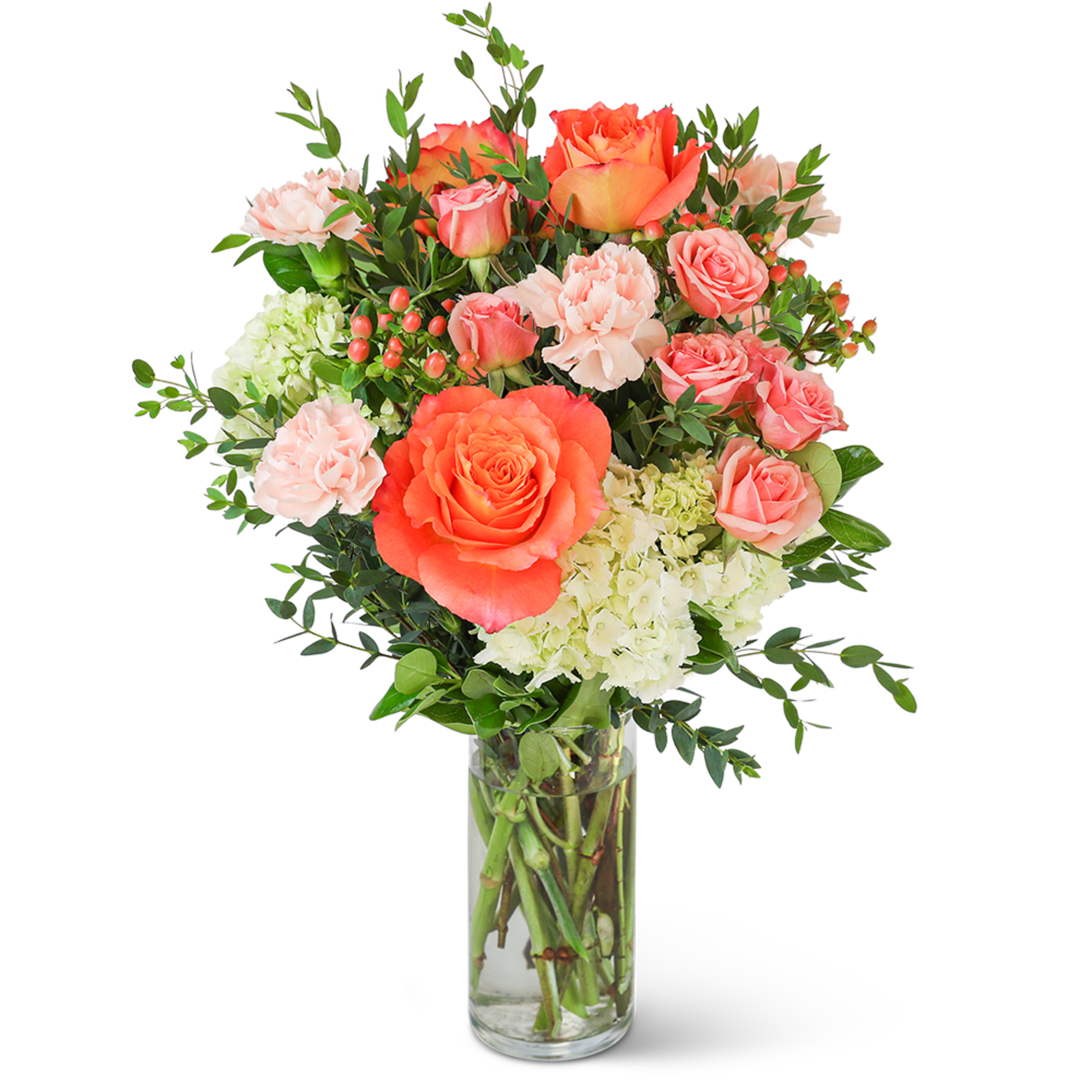 Coral and pink roses with carnations in a clear glass vase