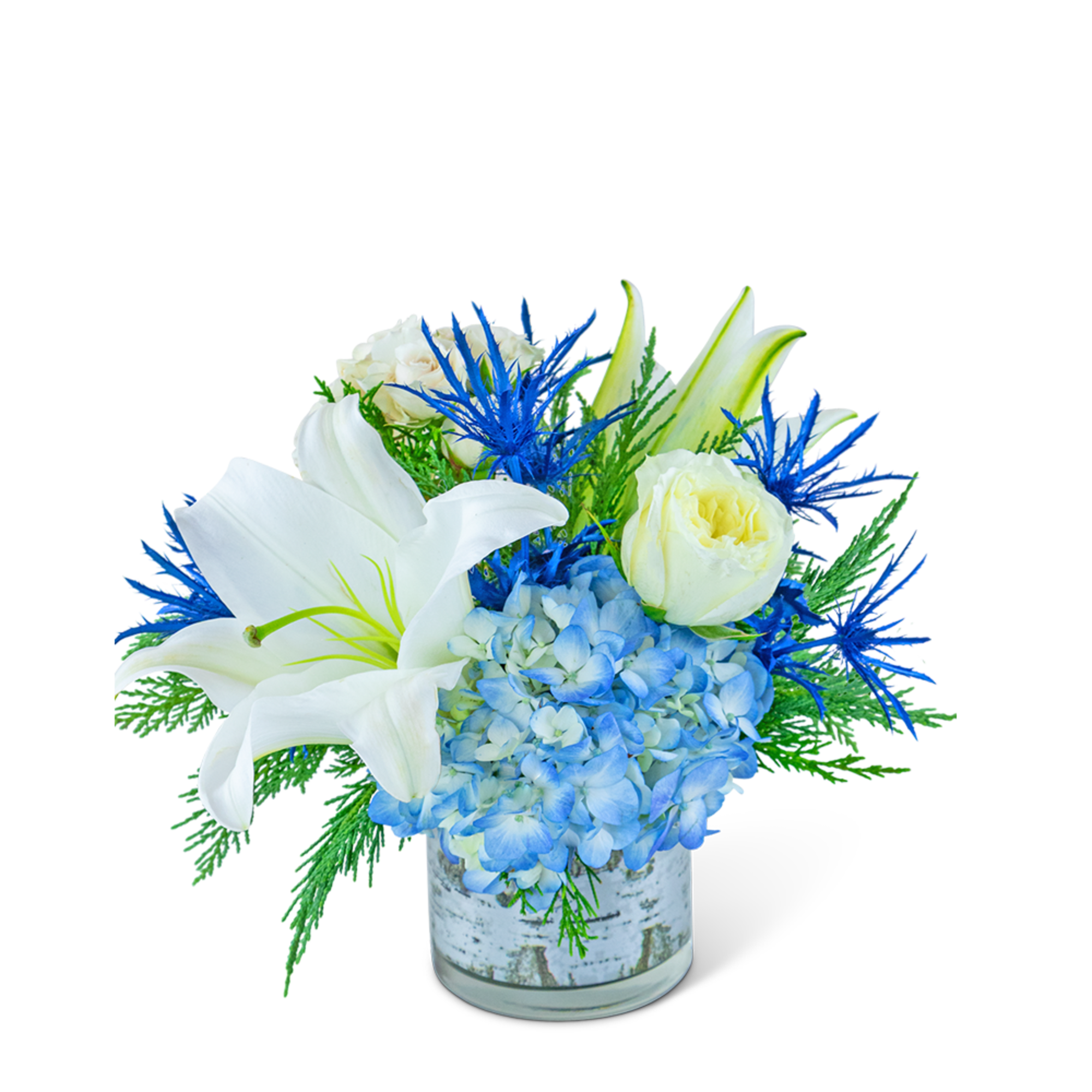 White lilies and blue hydrangeas in a glass vase