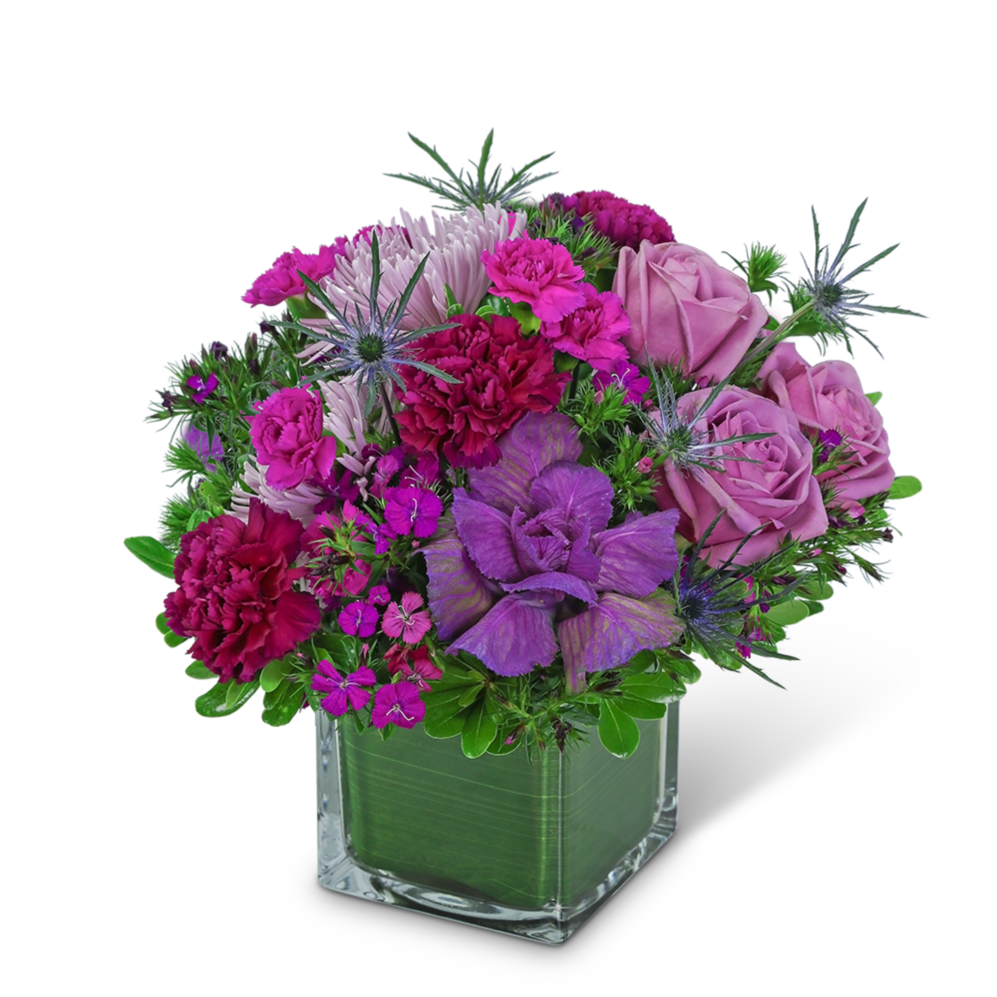 Purple and pink floral arrangement in a square glass vase