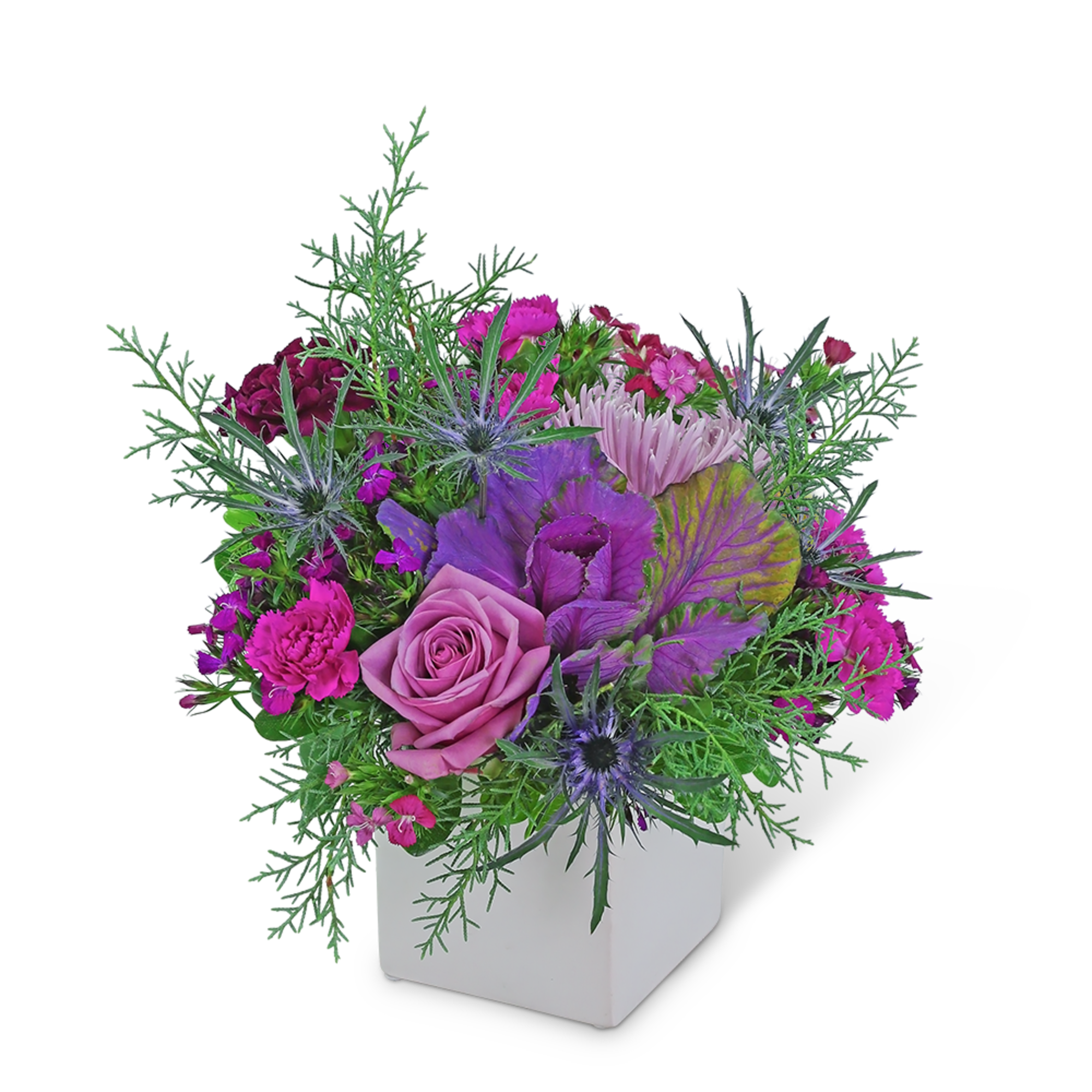 Pink and purple floral arrangement in a white square vase