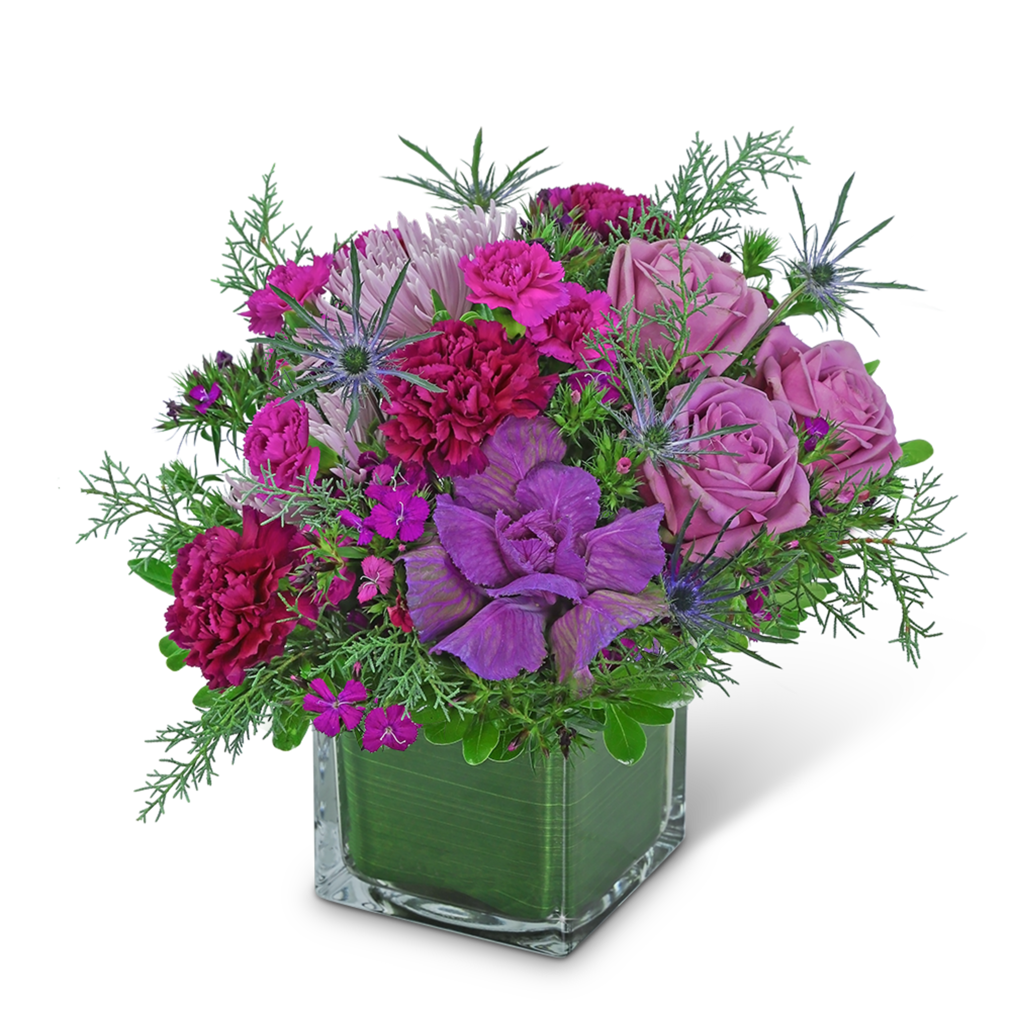 Purple and pink flower arrangement in a square glass vase
