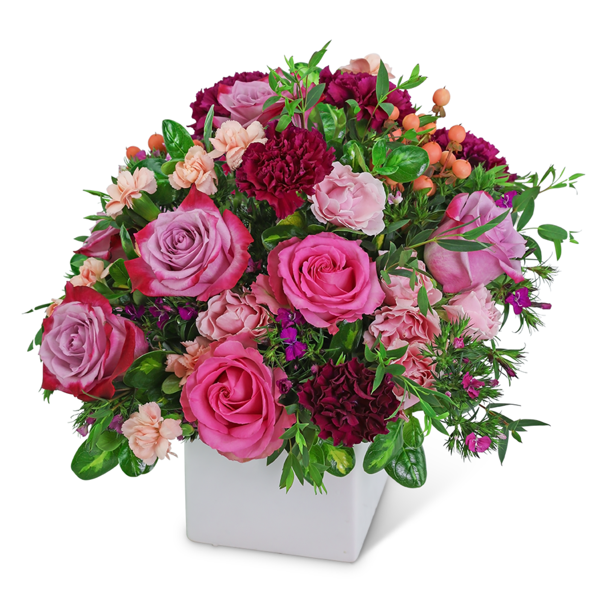Pink and burgundy rose arrangement in a white square vase