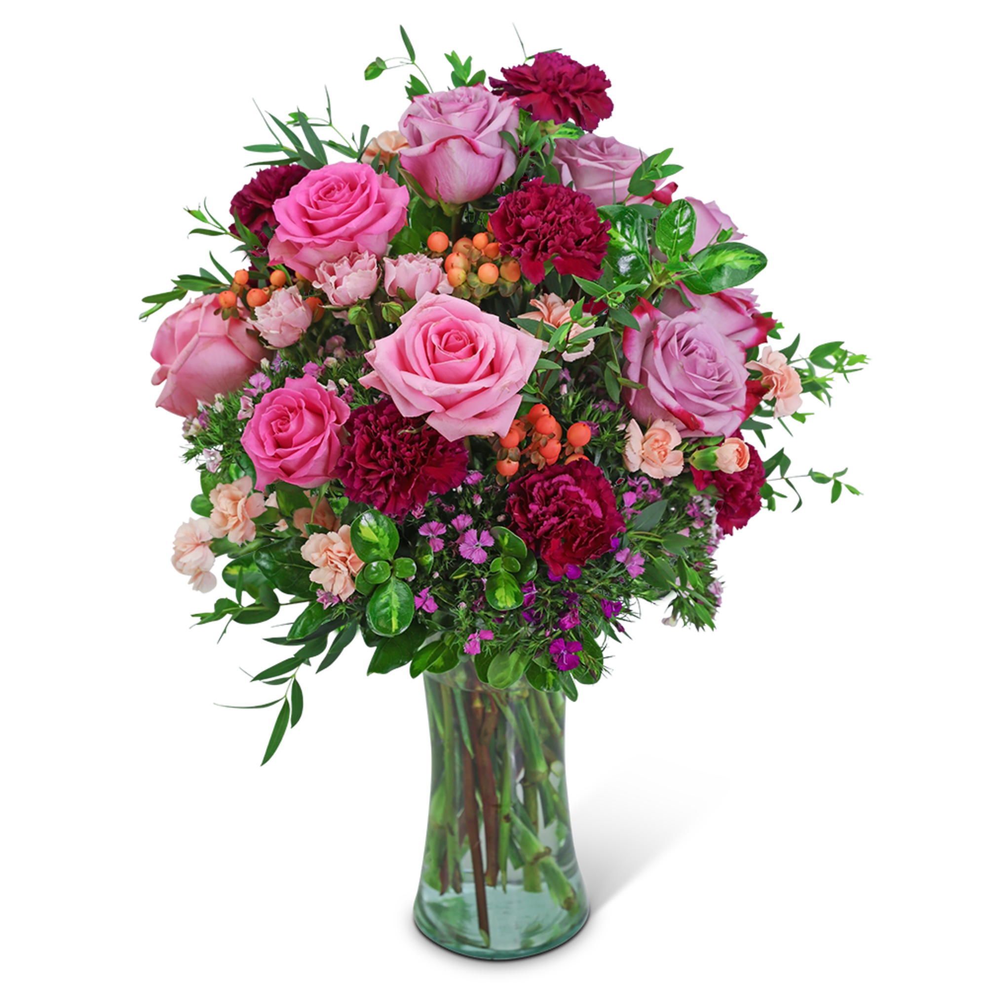 Pink and magenta roses with carnations in a clear glass vase