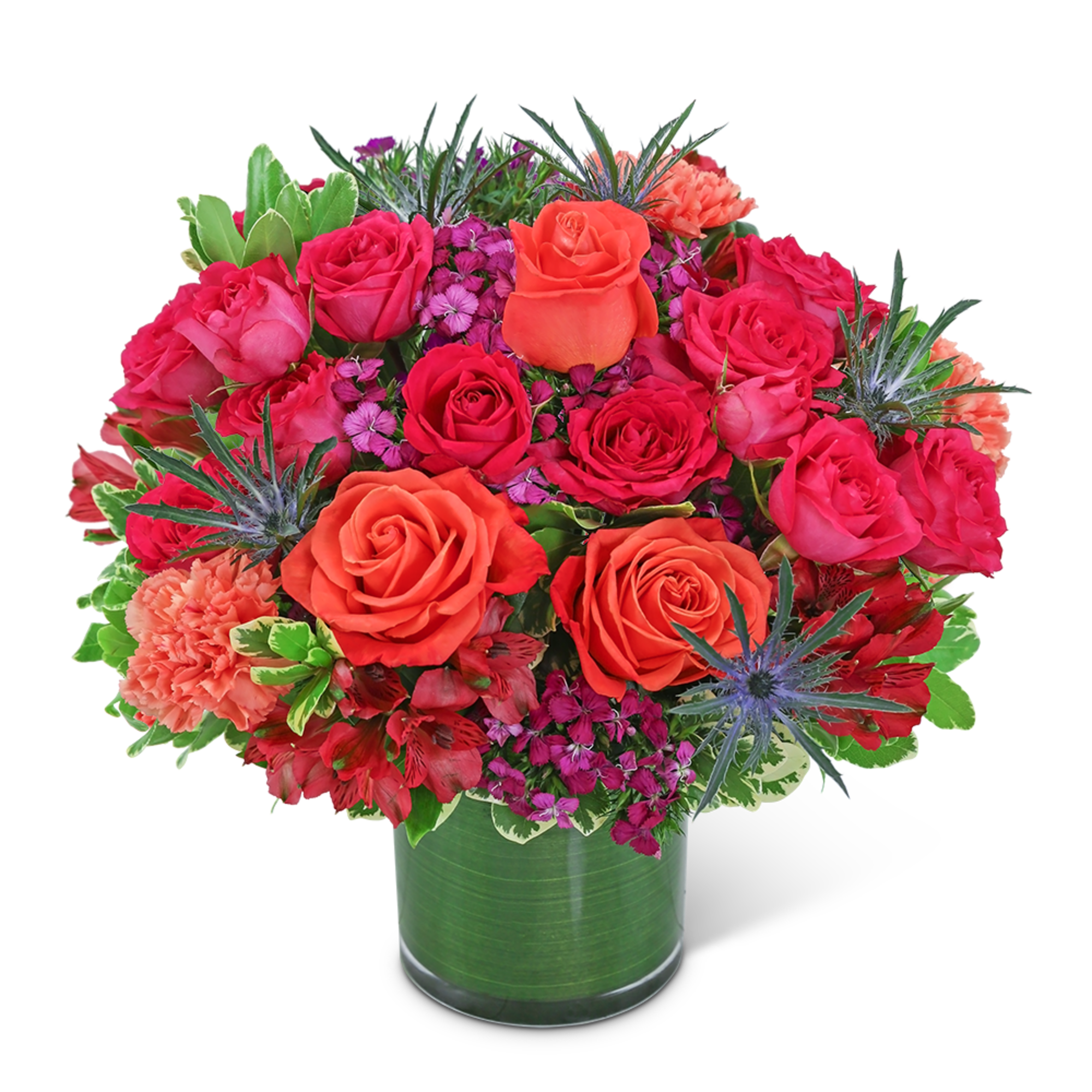 Bright pink and orange roses in a green glass vase