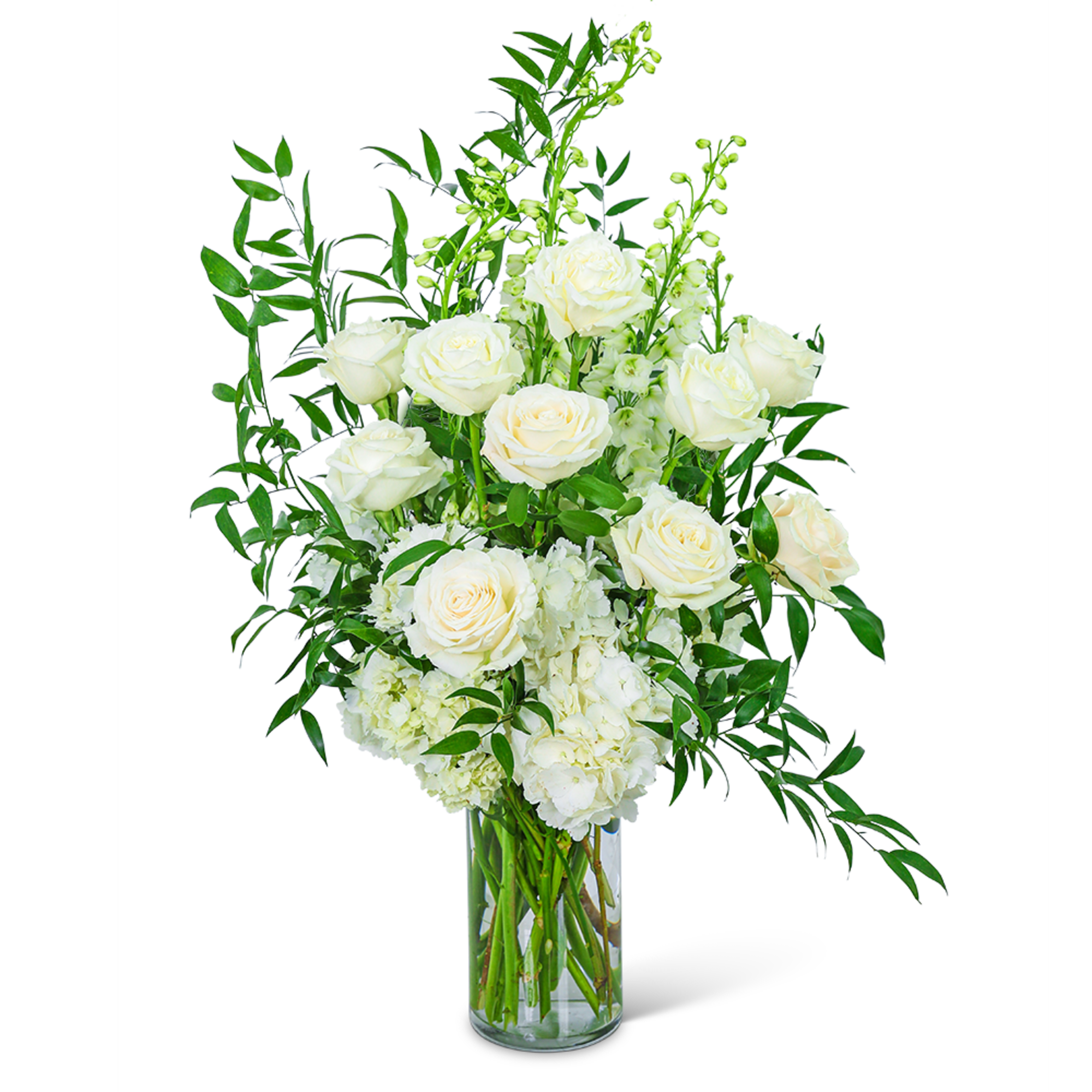 White roses and hydrangeas in a clear glass vase