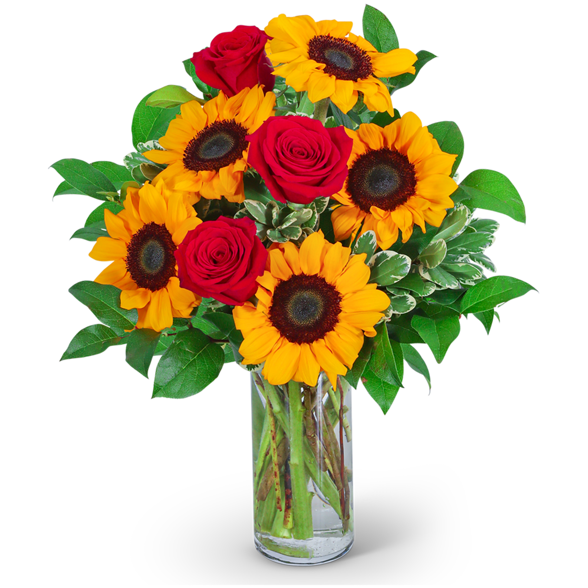 Sunflowers and red roses arranged in a clear glass vase