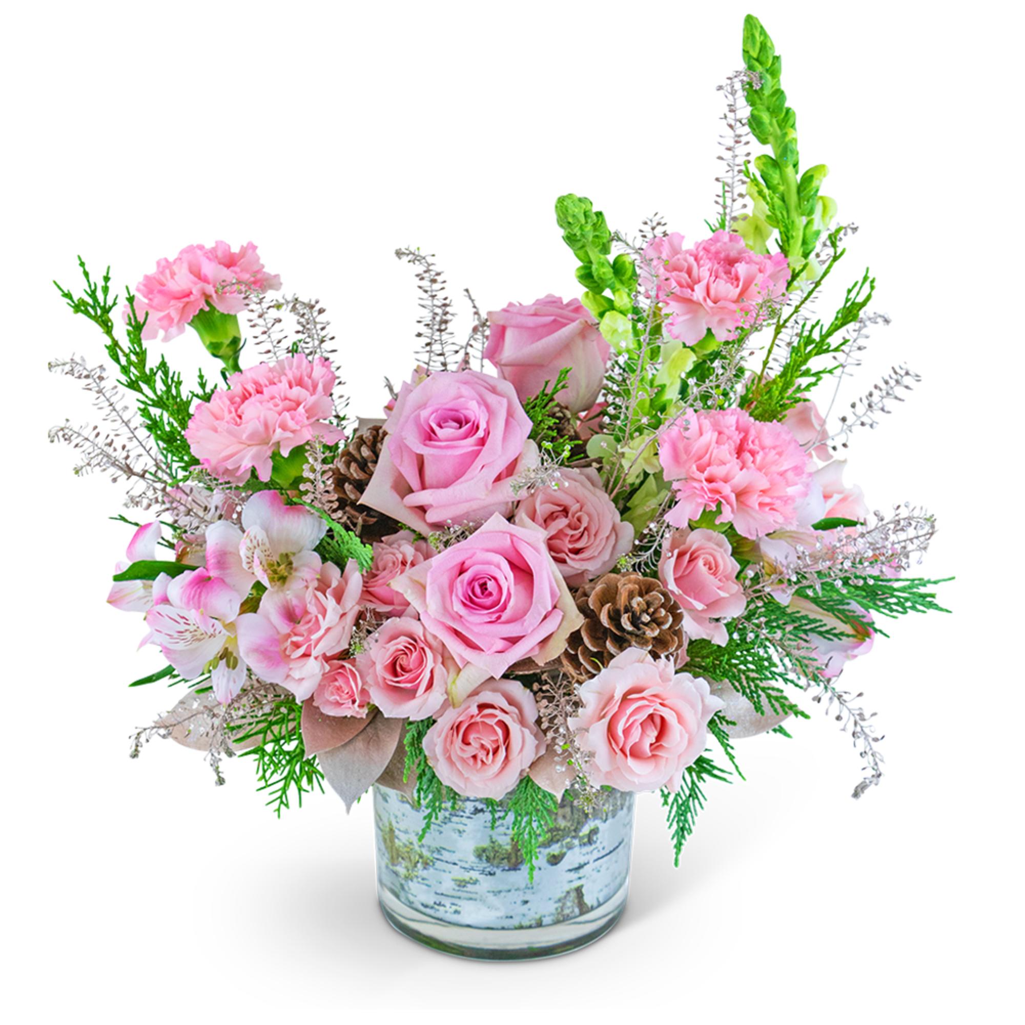 Pink roses and carnations in a glass vase with pinecones