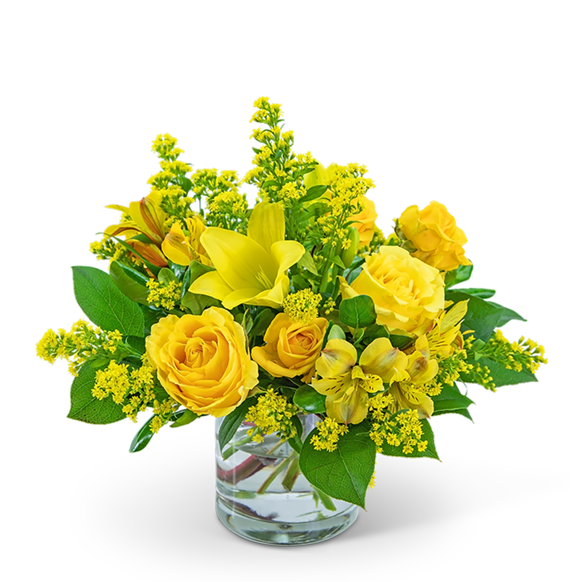 Yellow roses and lilies in a clear glass vase