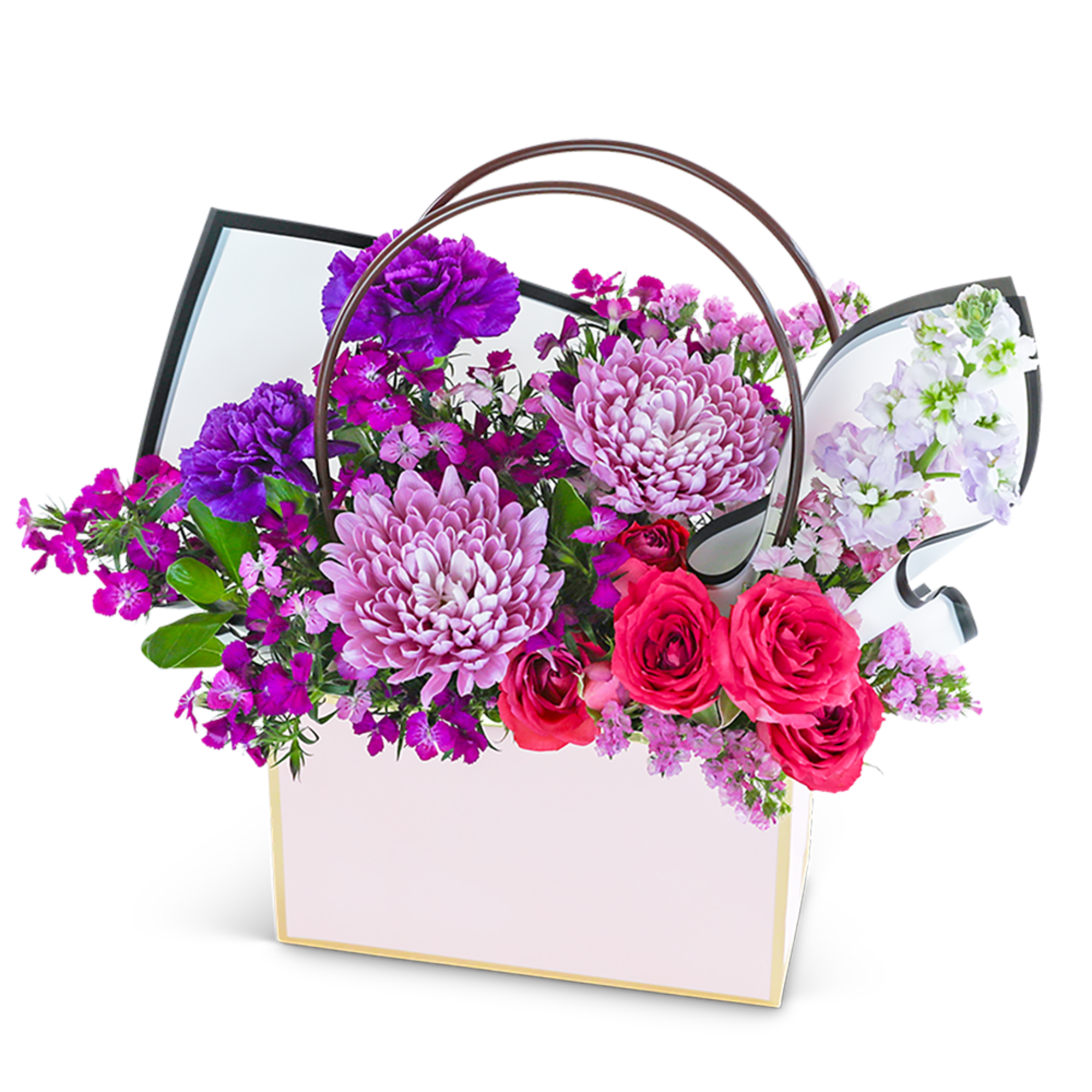 Mixed pink and purple flowers in a white gift basket with handles