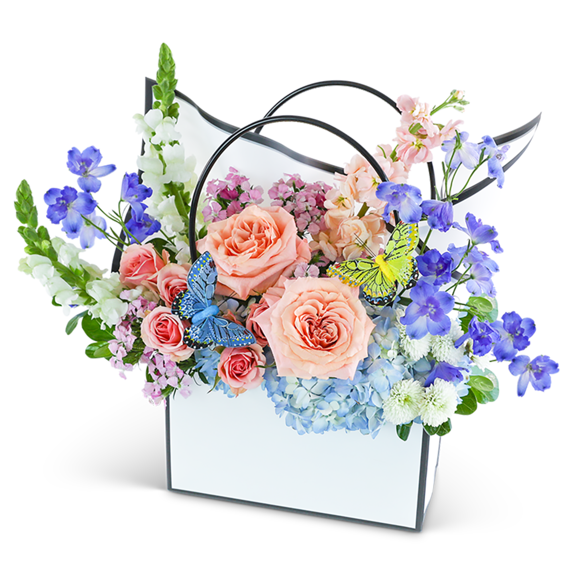Pastel flower arrangement in a white handled box with butterfly accents