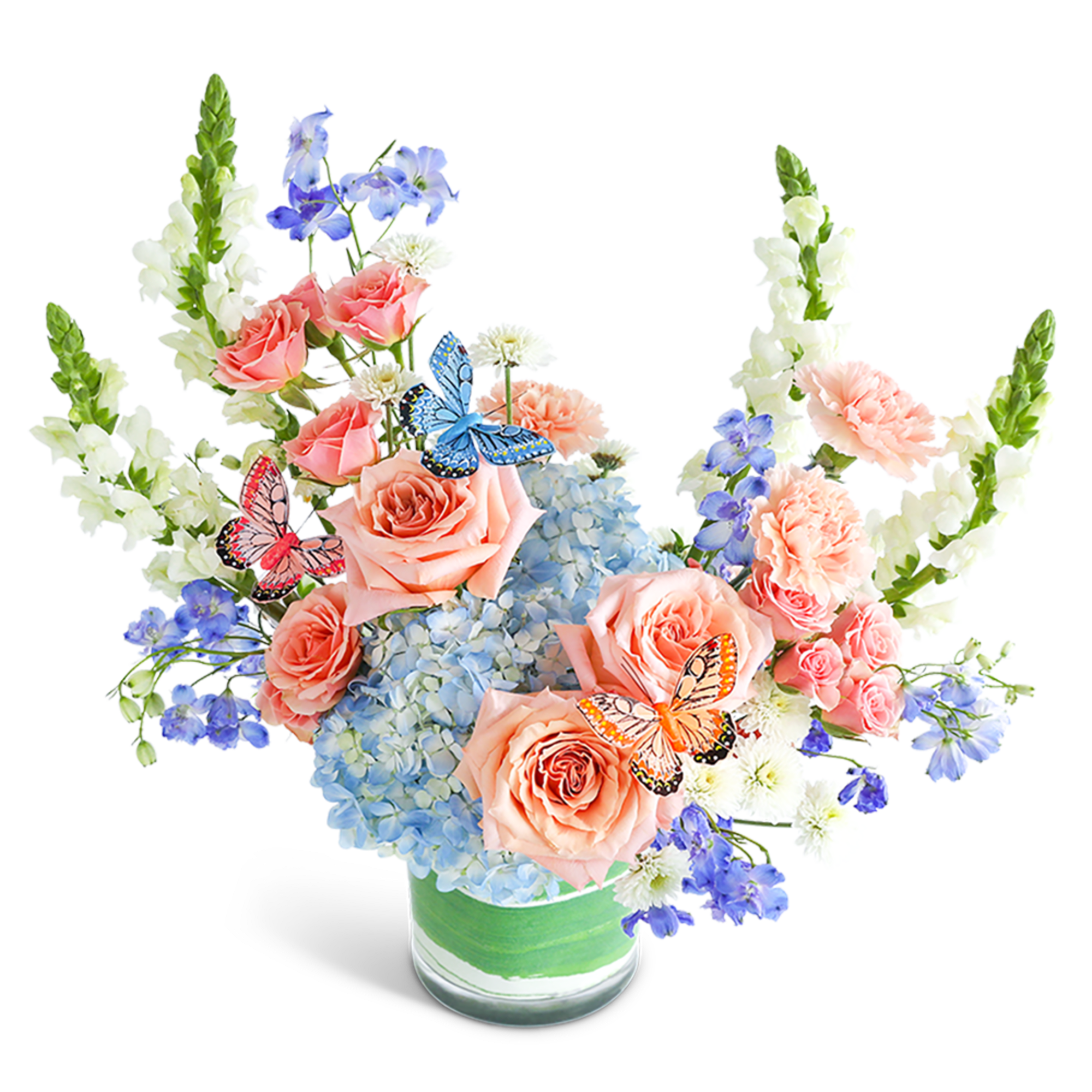 Peach roses and blue hydrangeas in a glass vase with butterfly accents