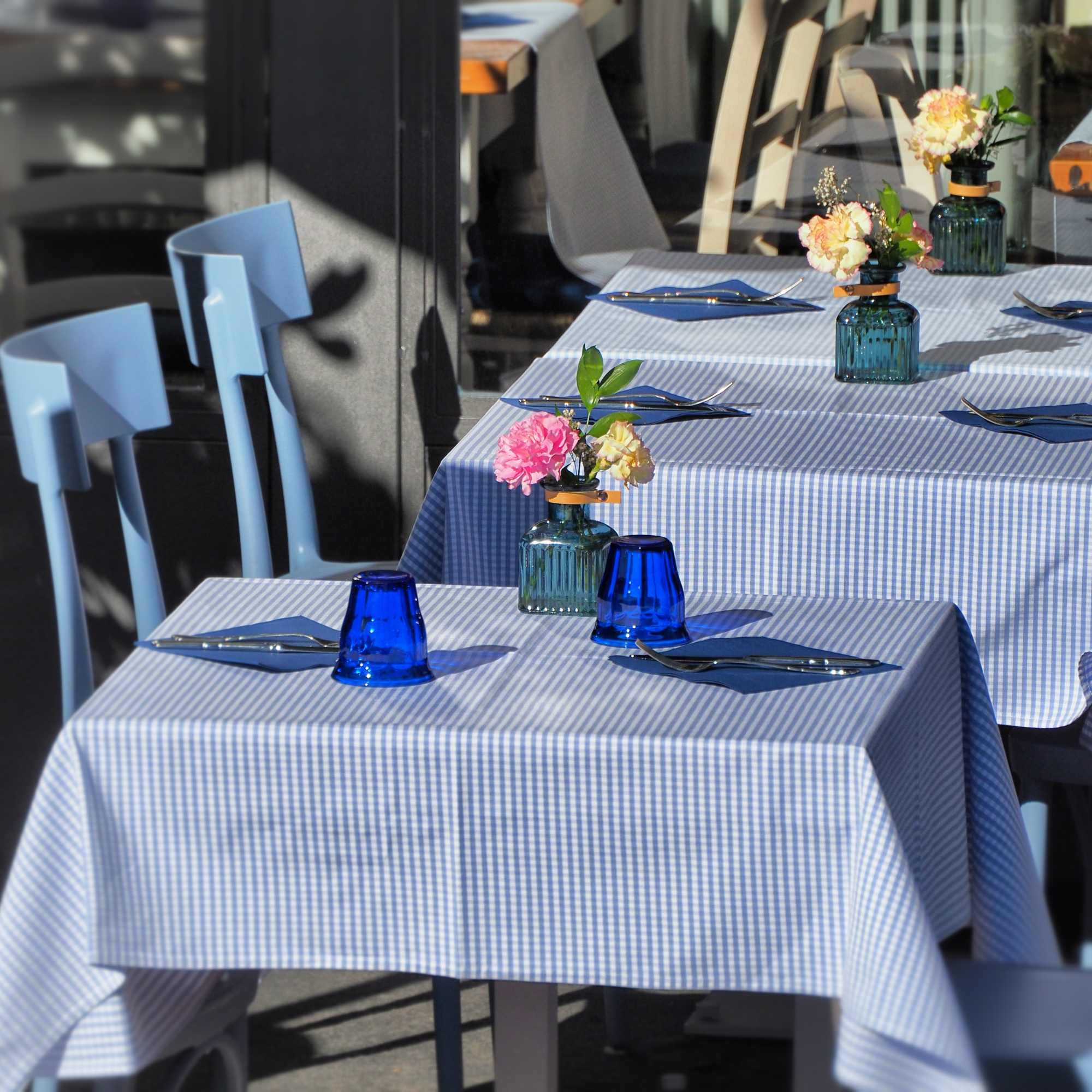 custom order simple arrangements for your restaurant tables. flowers vary week to