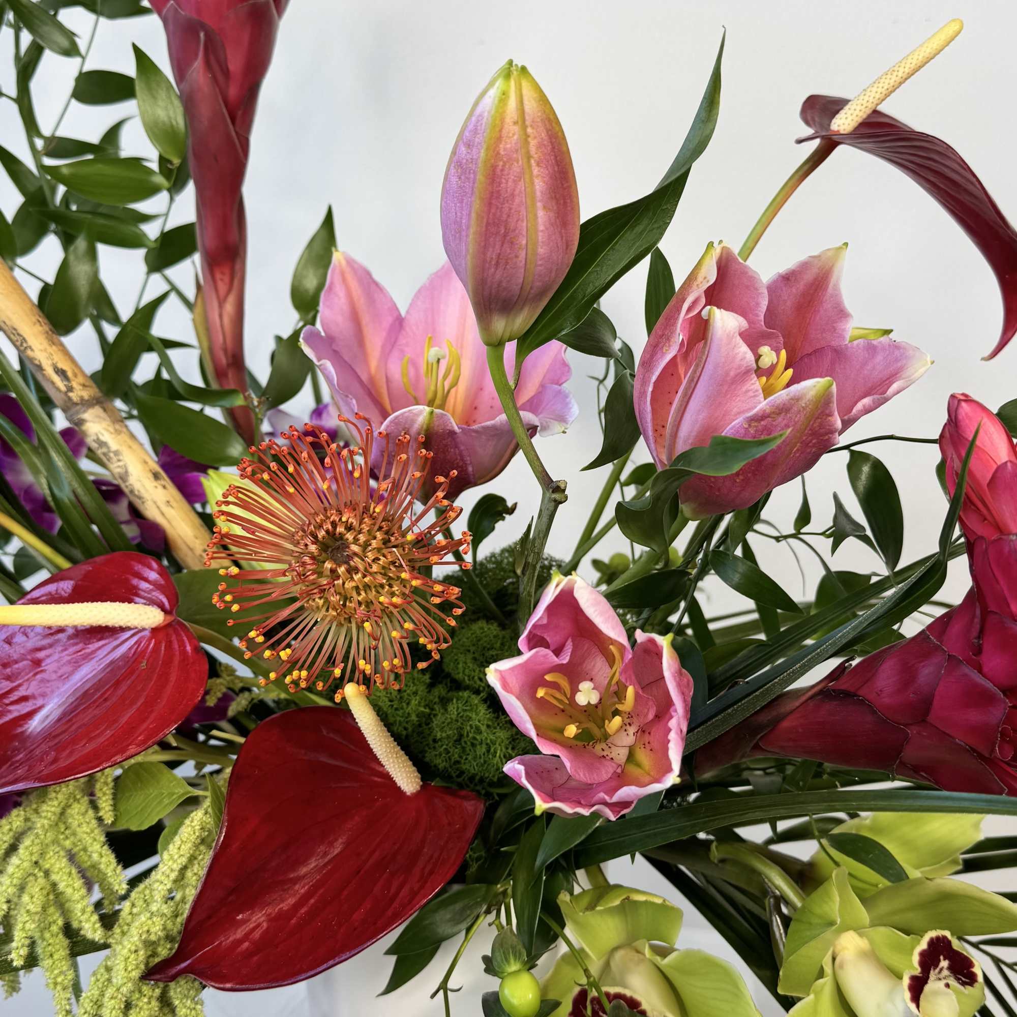 Escape to paradise with this stunning tropical floral arrangement designed to instantly