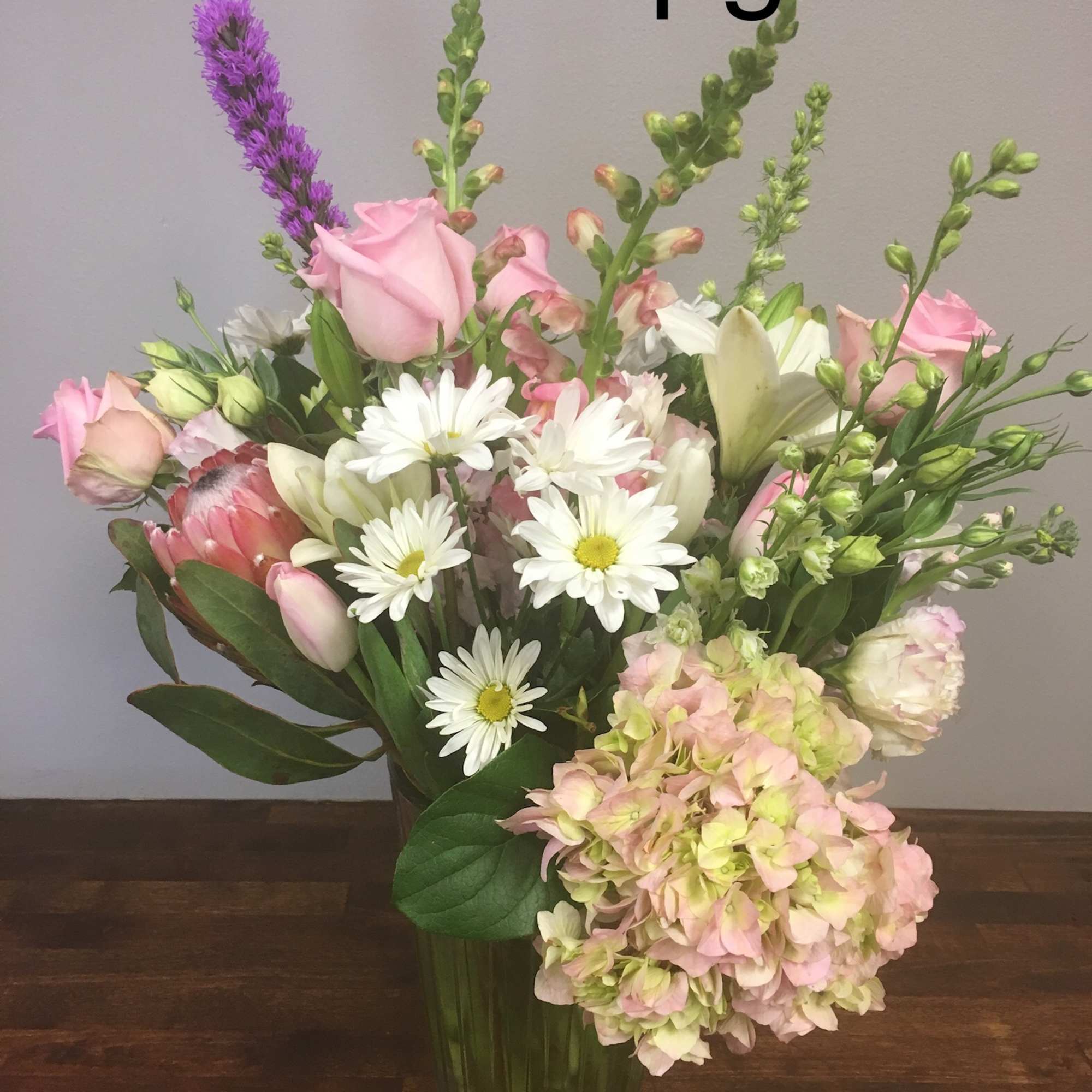 Pink and white mixed bouquet in a glass vase