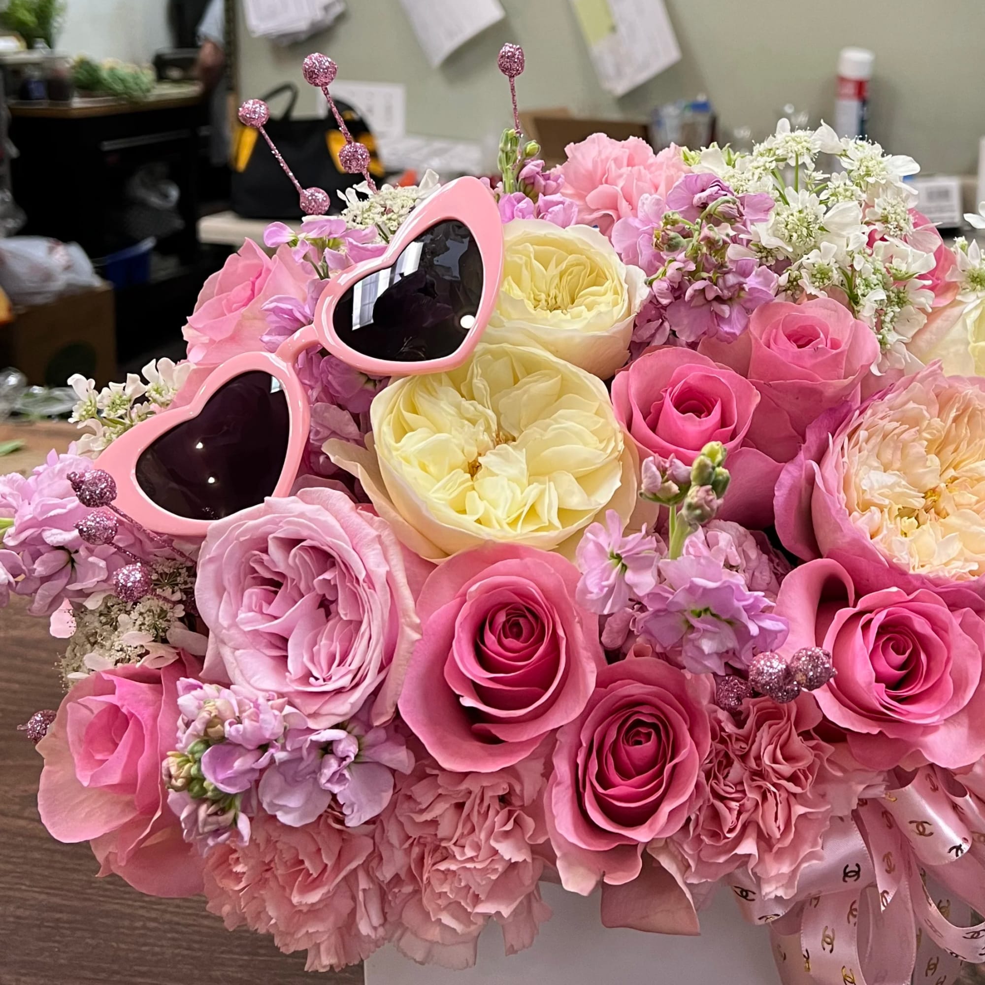 Pink and cream rose bouquet with heart-shaped sunglasses