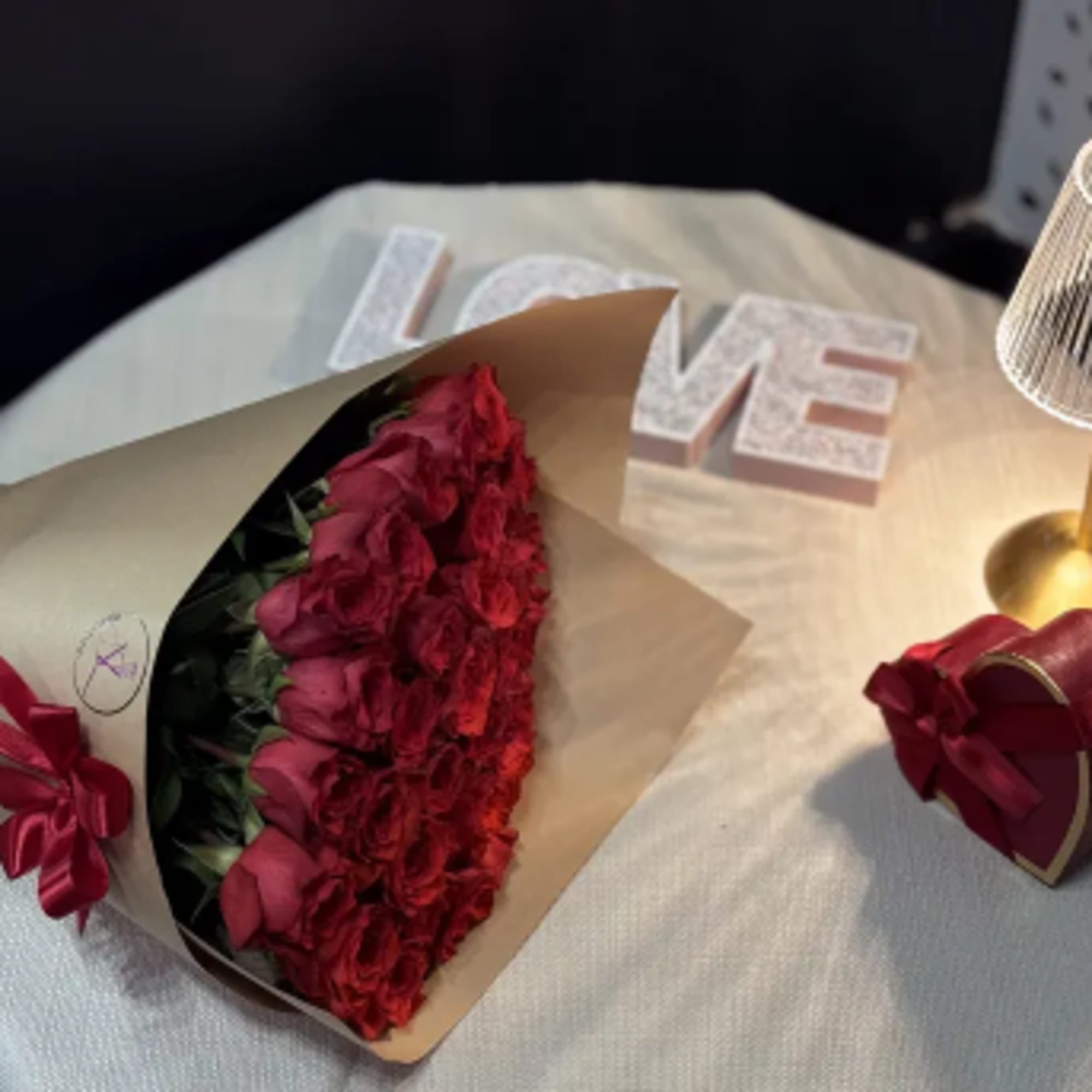 A stunning arrangement of fresh, premium red roses, carefully selected for their, photo 2 of 3