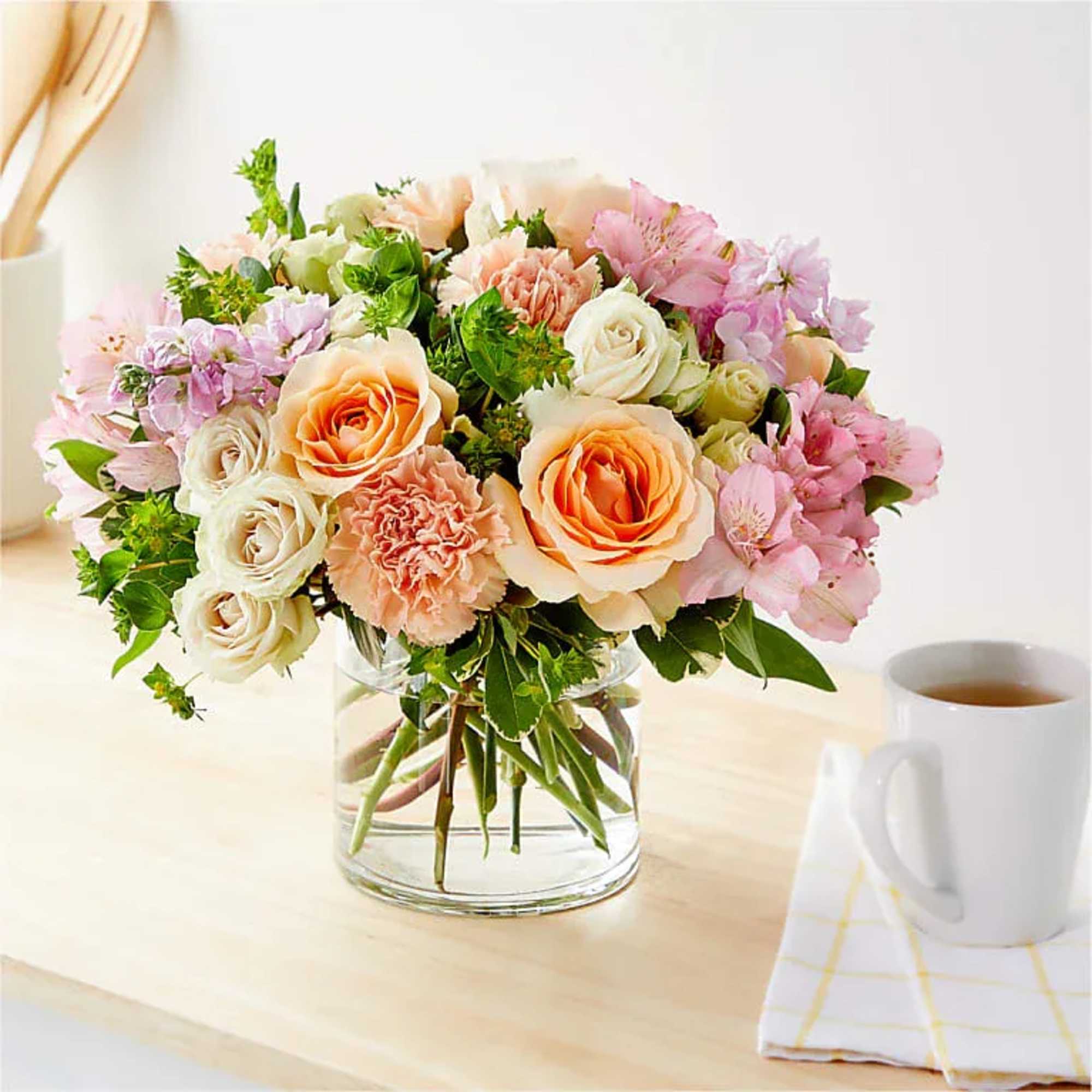 Soft and charming, the Lush Blooms Arrangement brings a delicate touch of