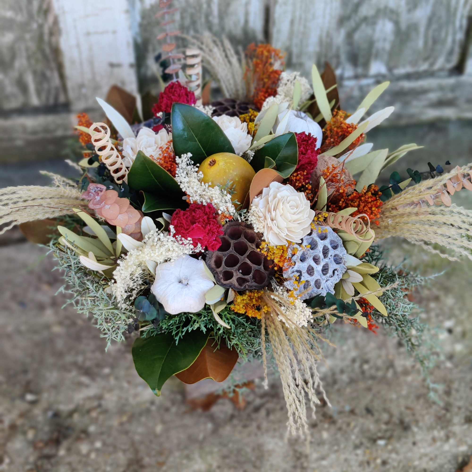 Mixed bouquet with white and red flowers and dried accents