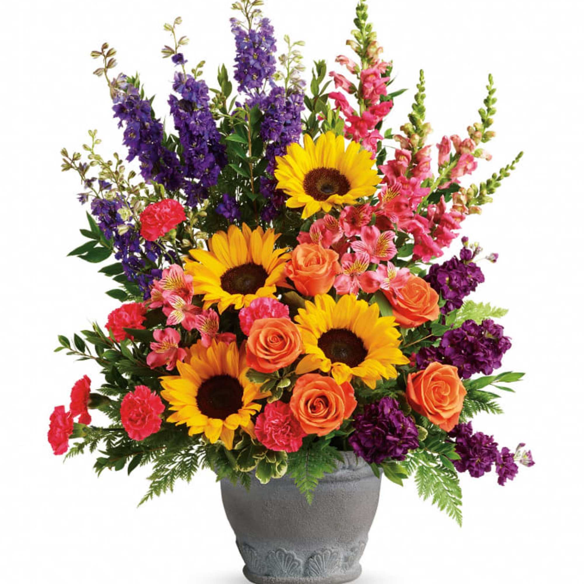 A colorful reminder that brighter days are ahead, this uplifting arrangement of