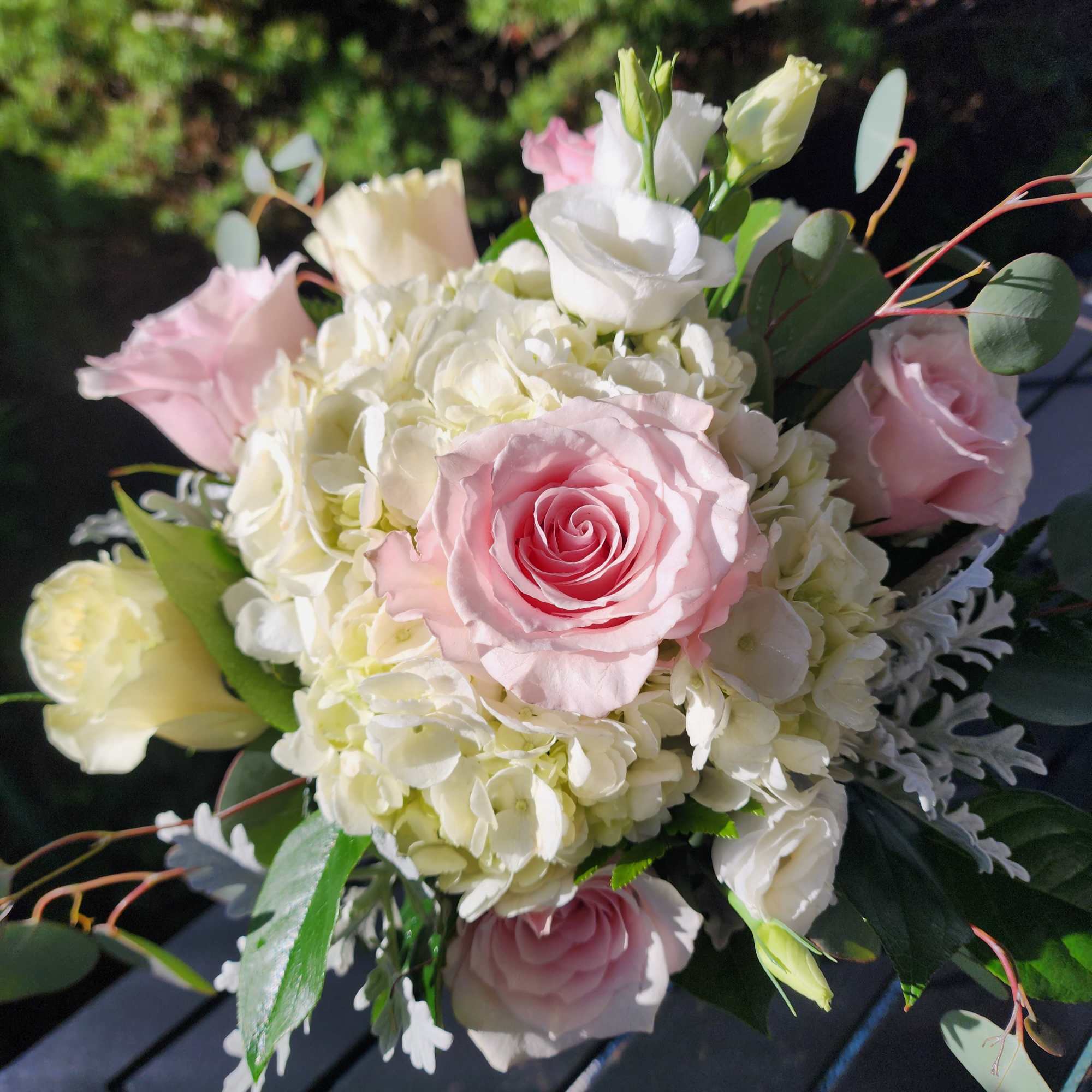 Pink and white rose bouquet with hydrangeas and eucalyptus