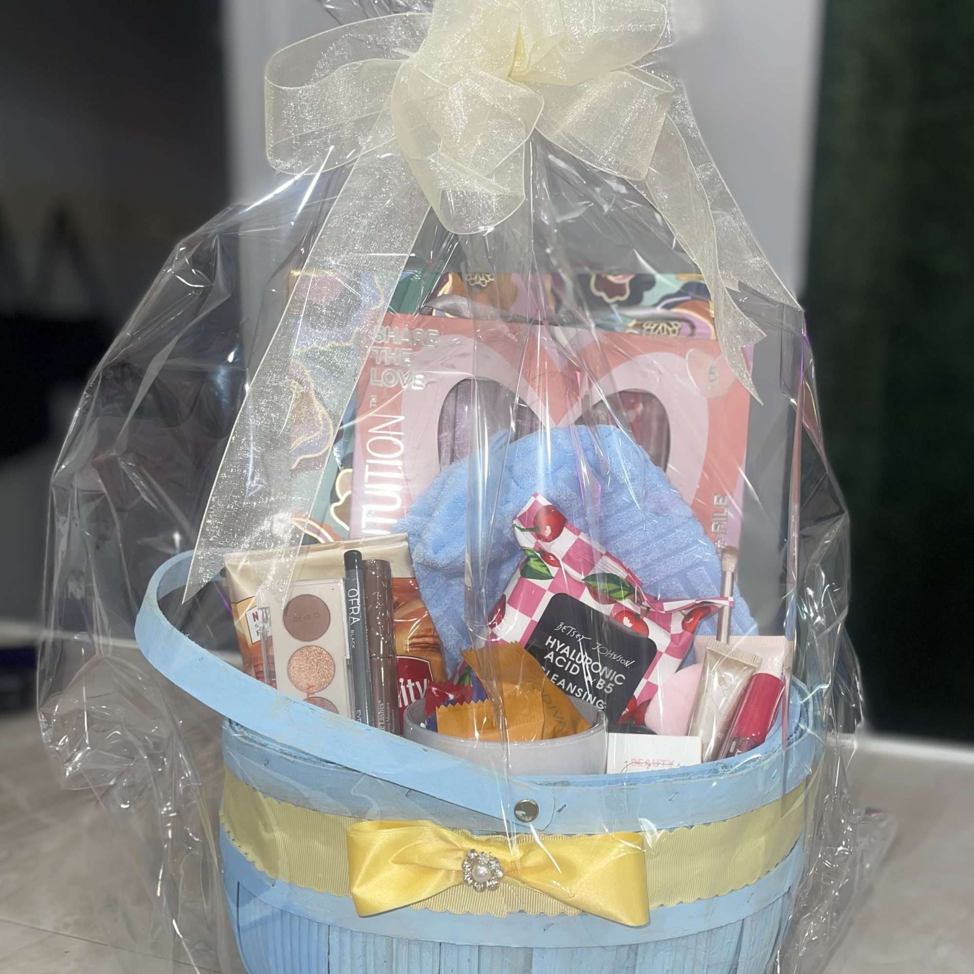 Soft pastels and pampering treats make this Makeup Lover Gift Basket an