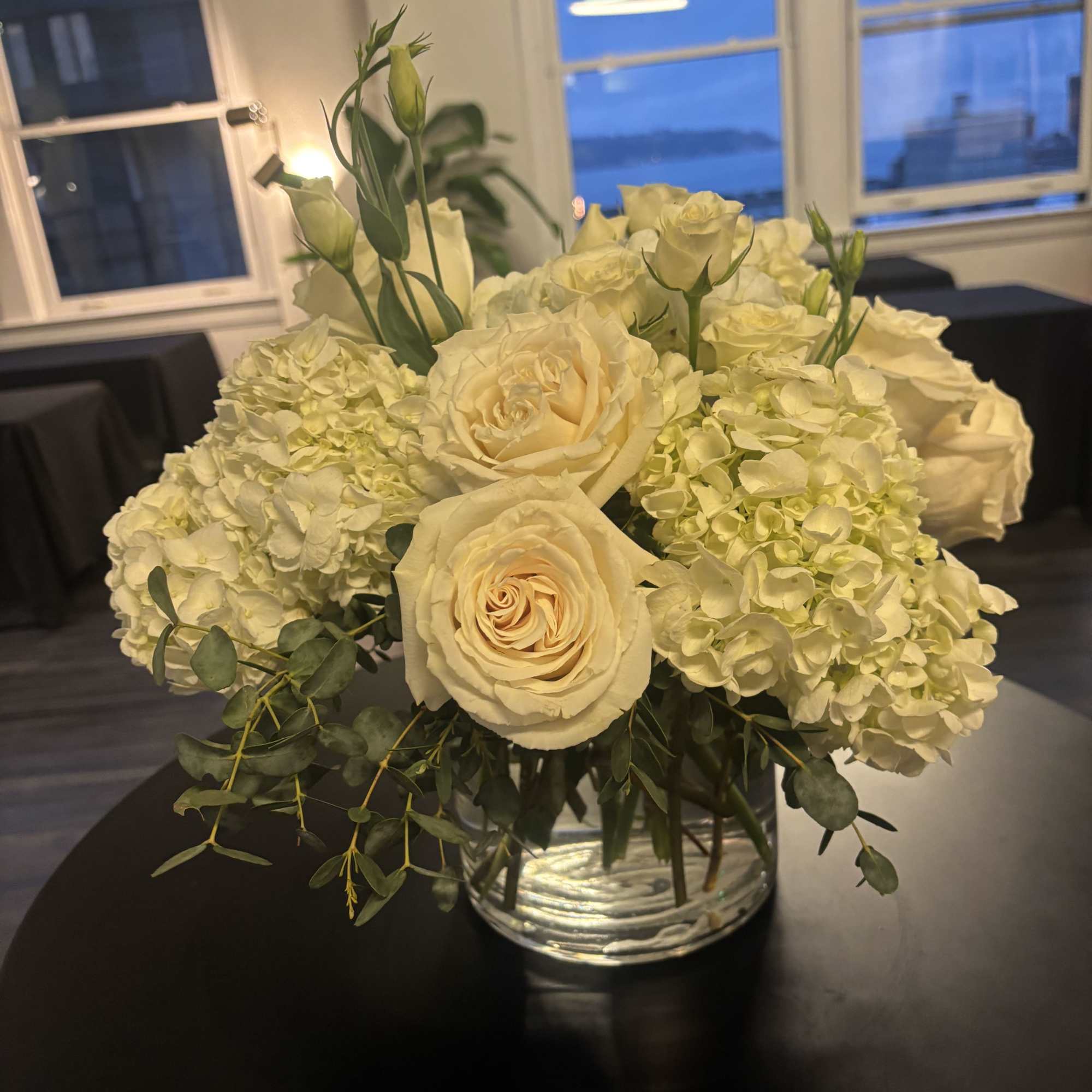 New beginnings deserve flowers! This all white arrangement includes roses, lisiantus and, photo 2 of 2