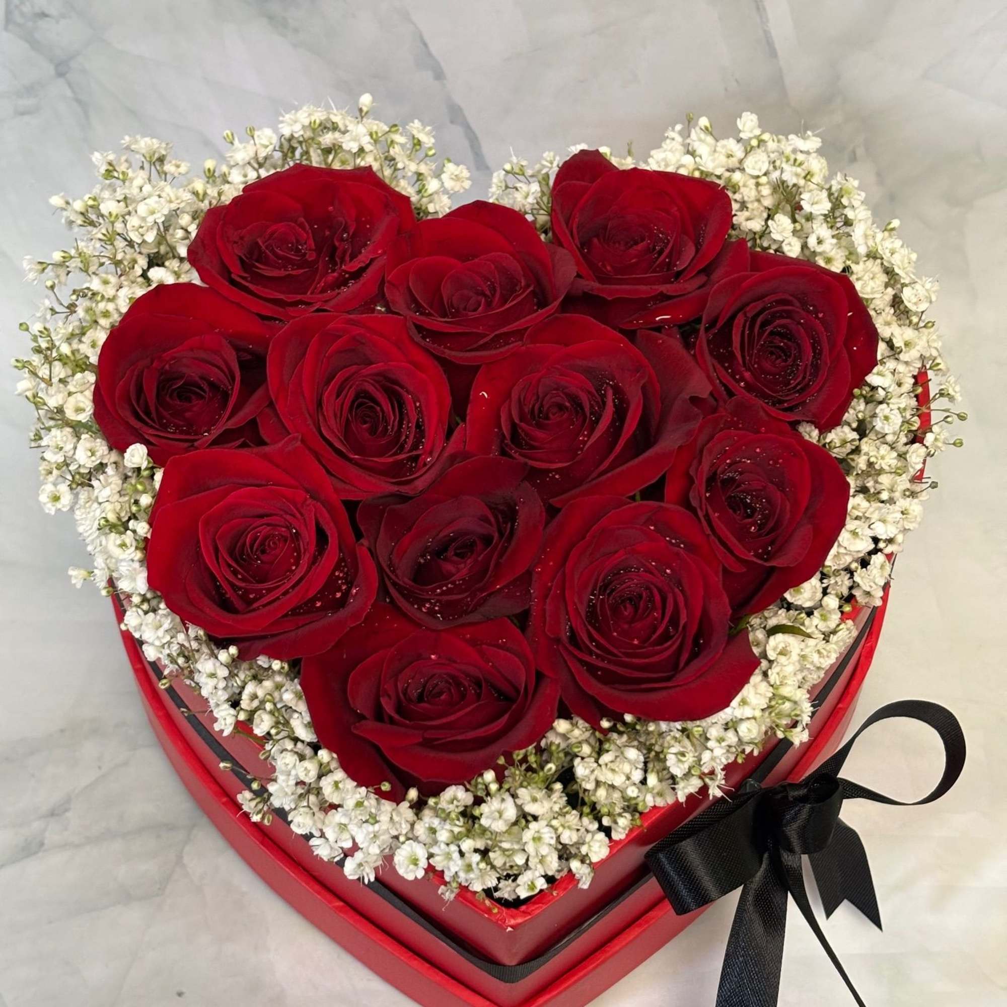 This arrangement is full of 12 fresh red roses that are designed, photo 2 of 2