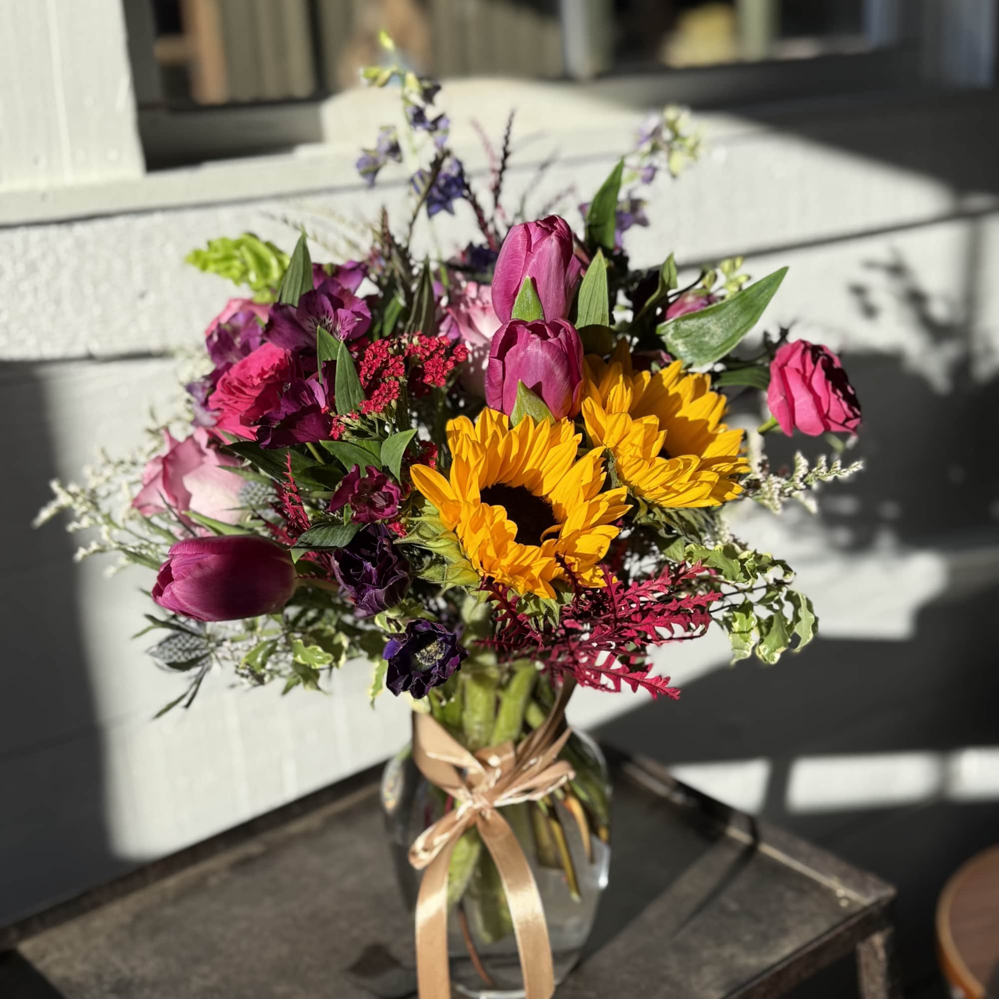 This country wildflower&ndash;inspired arrangement brings the charm of open fields and simple