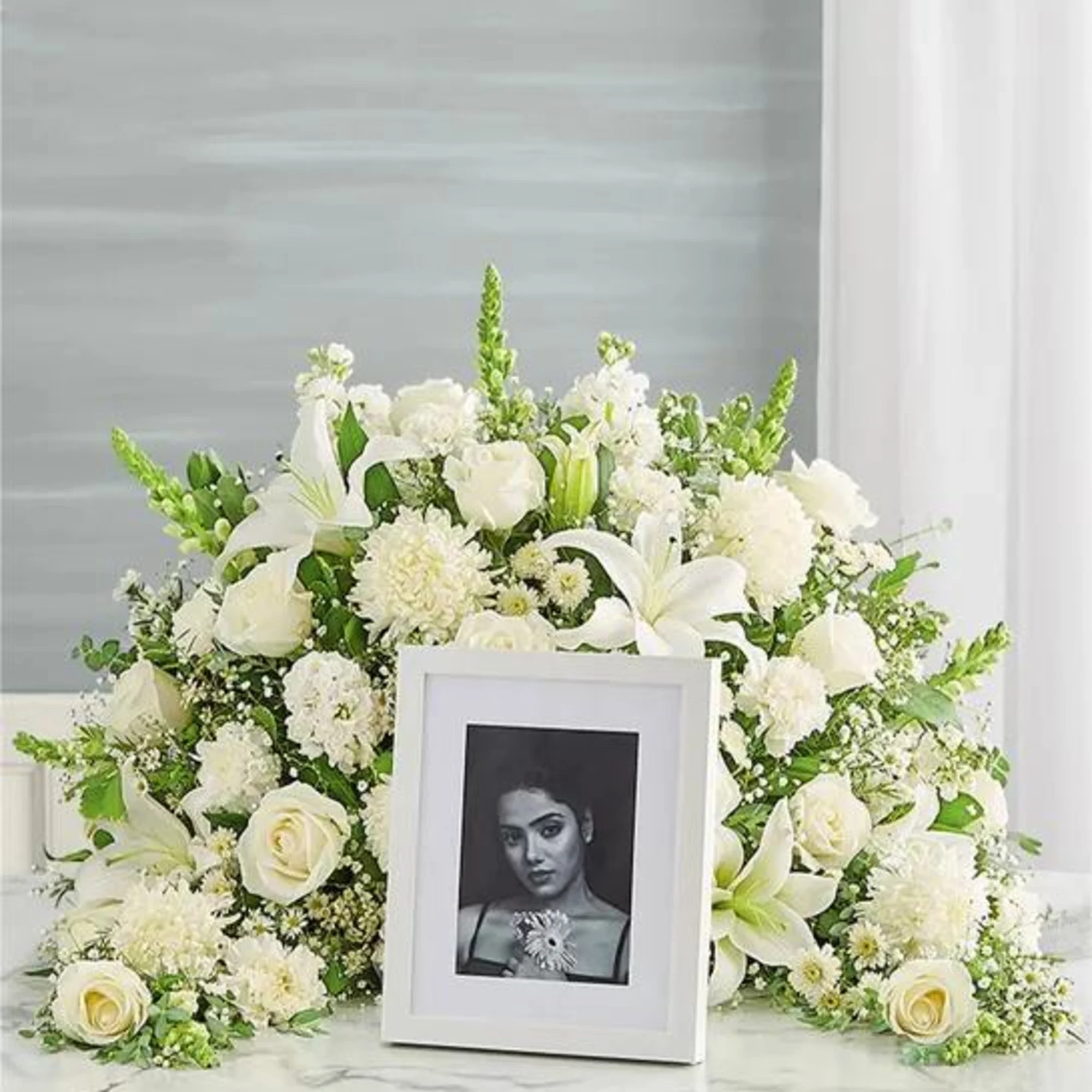 Express your heartfelt condolences with a beautiful floral tribute.One-sided arrangement of white, photo 2 of 2