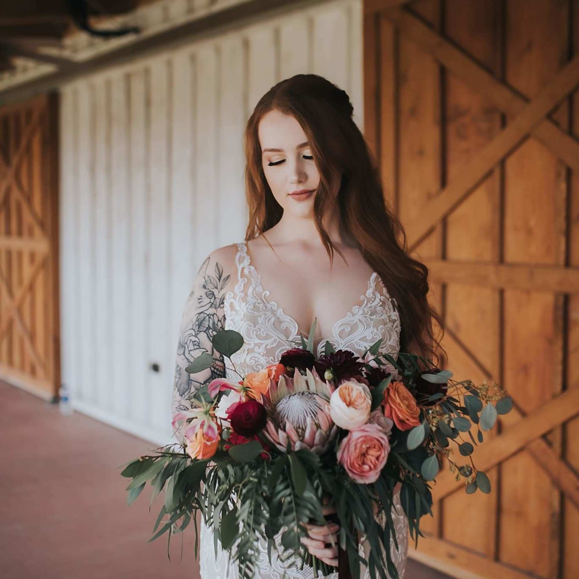 Bride holding a colorful bouquet of mixed flowers