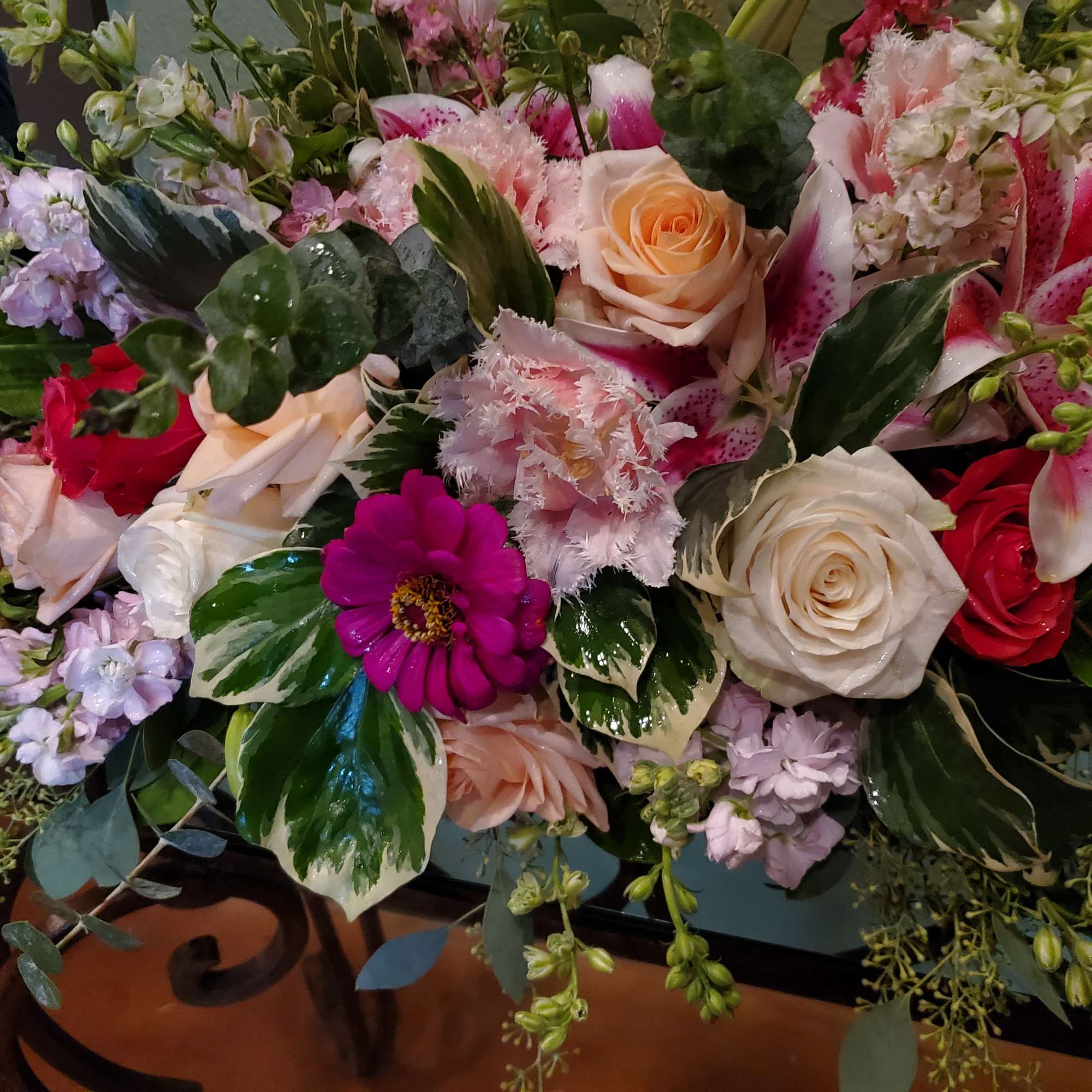 Mixed bouquet with roses, lilies, and pink flowers