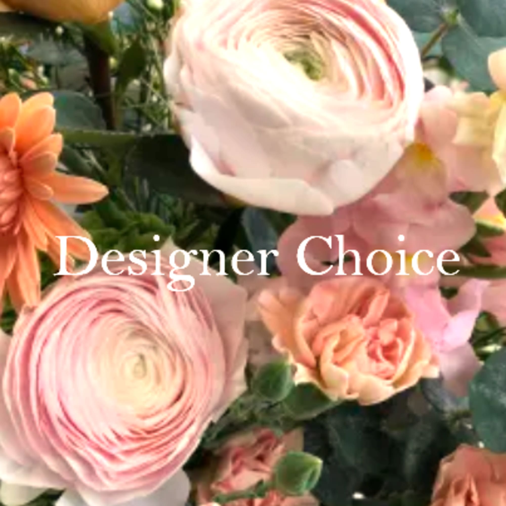 Close-up of pastel pink and peach mixed flowers with 'Designer Choice' text over the arrangement