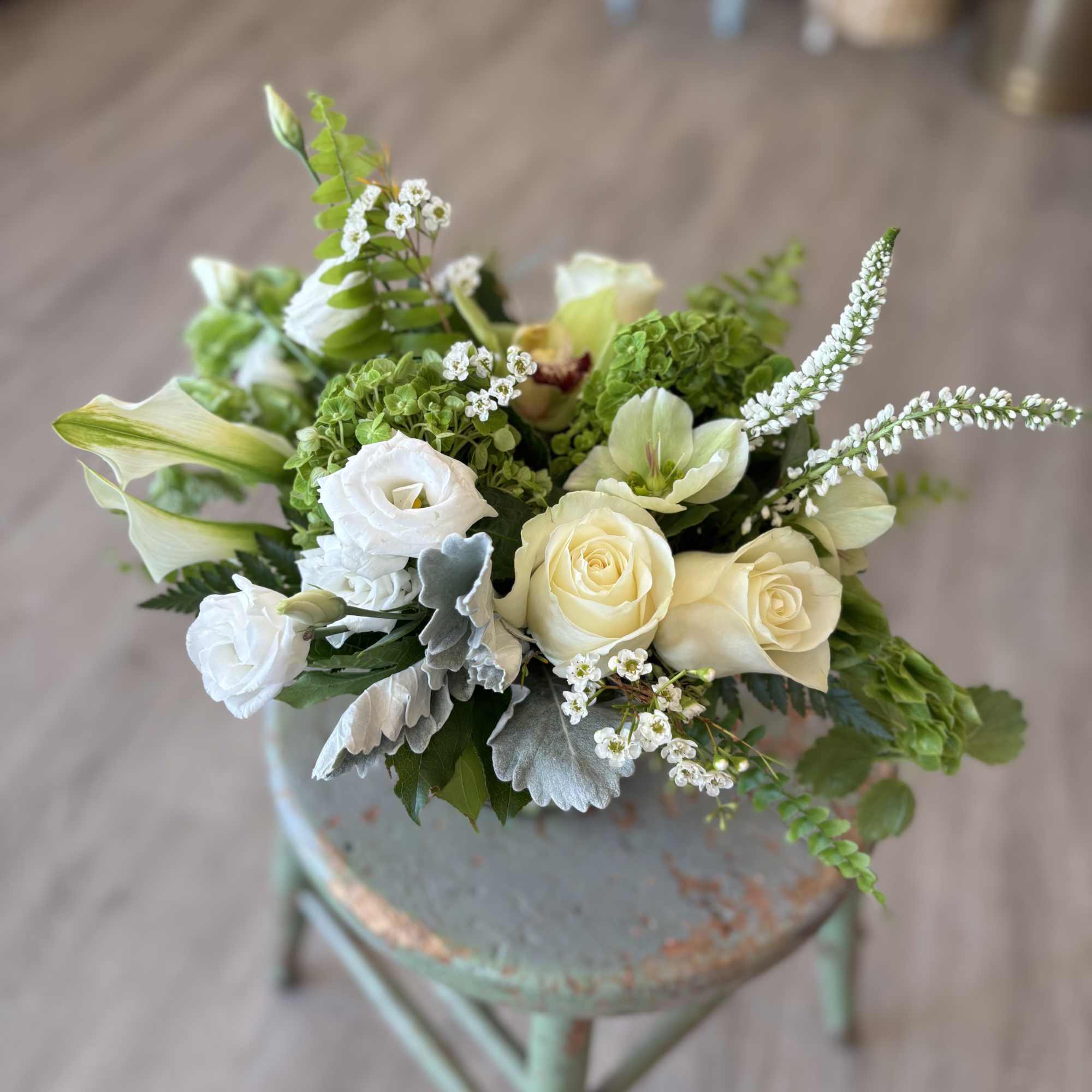 Bright and full of charm, the verdant joy arrangement is a stunning