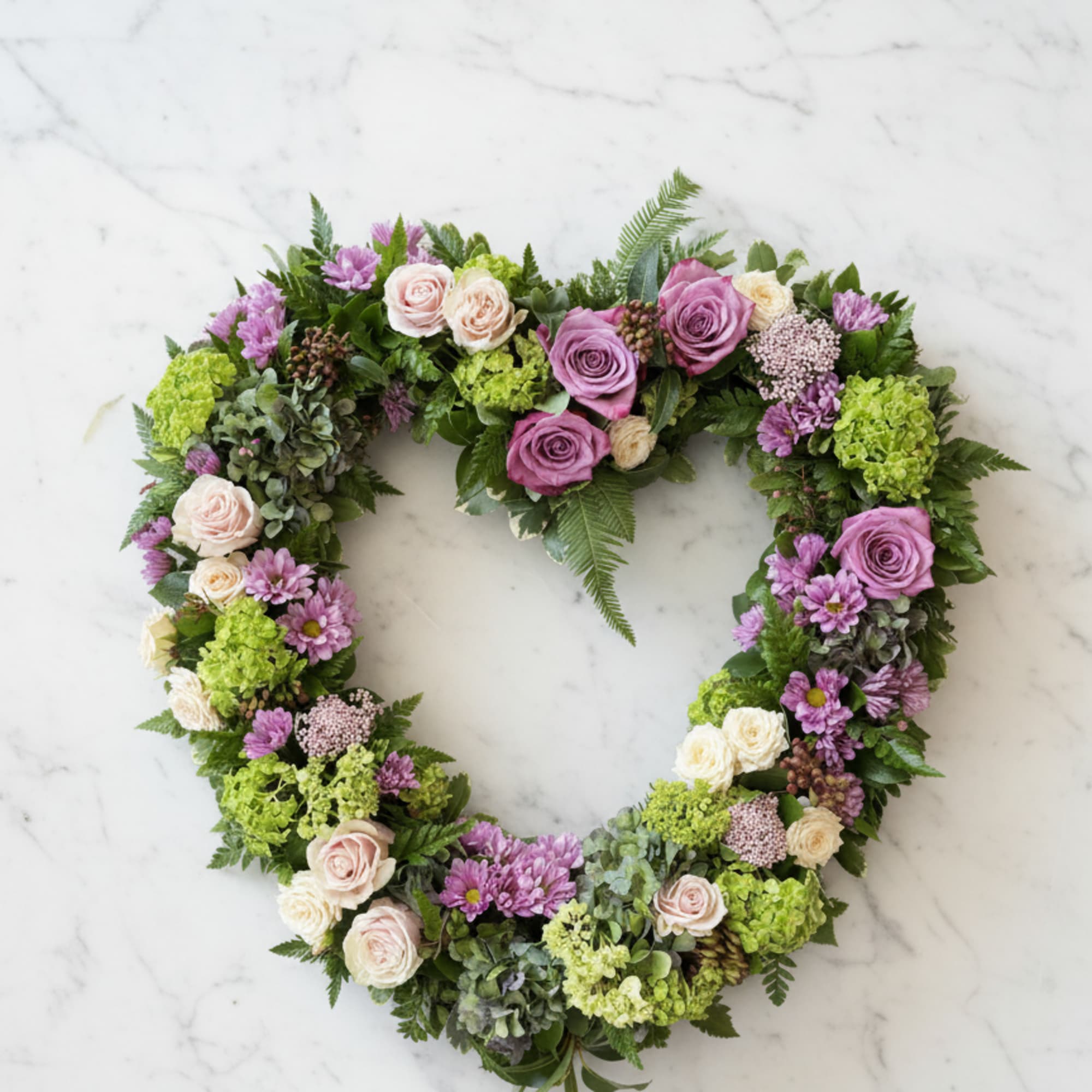 This gorgeous memorial wreath is a stunning way to send your expression