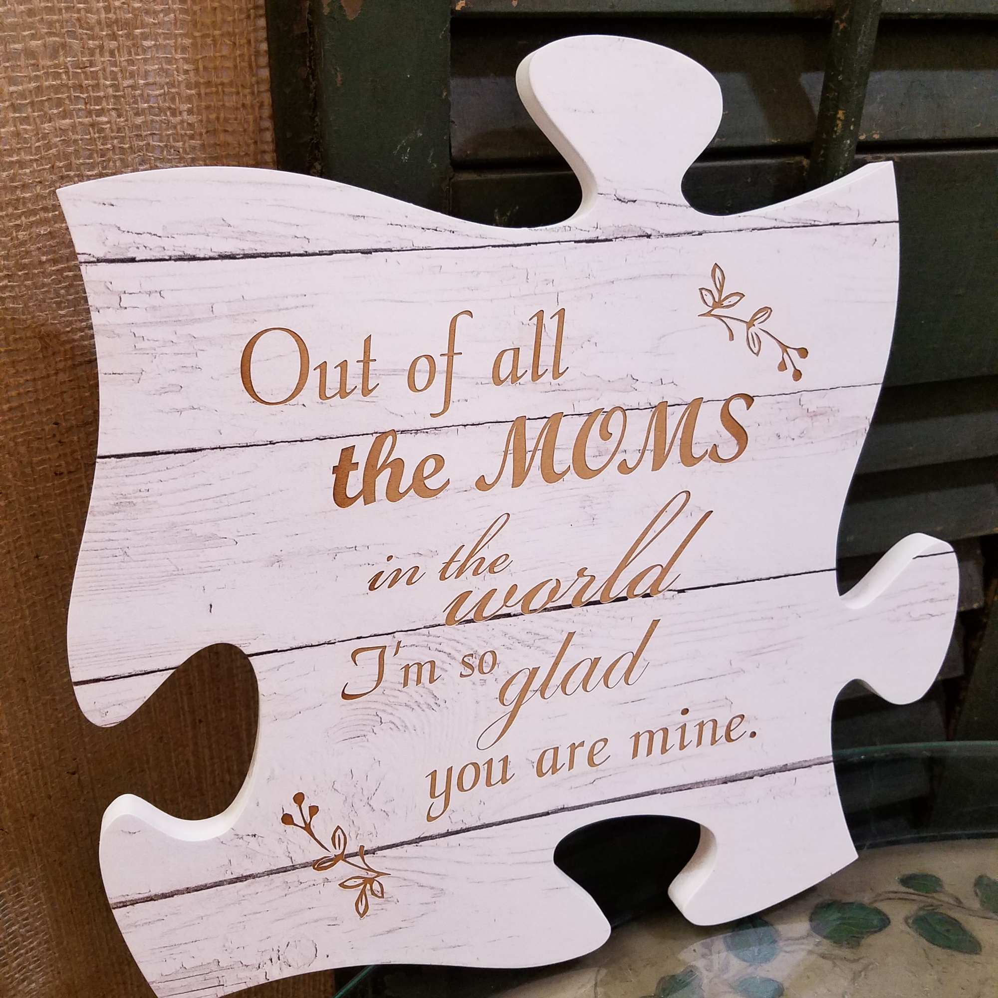 Puzzle-piece sign with a Mother's Day message