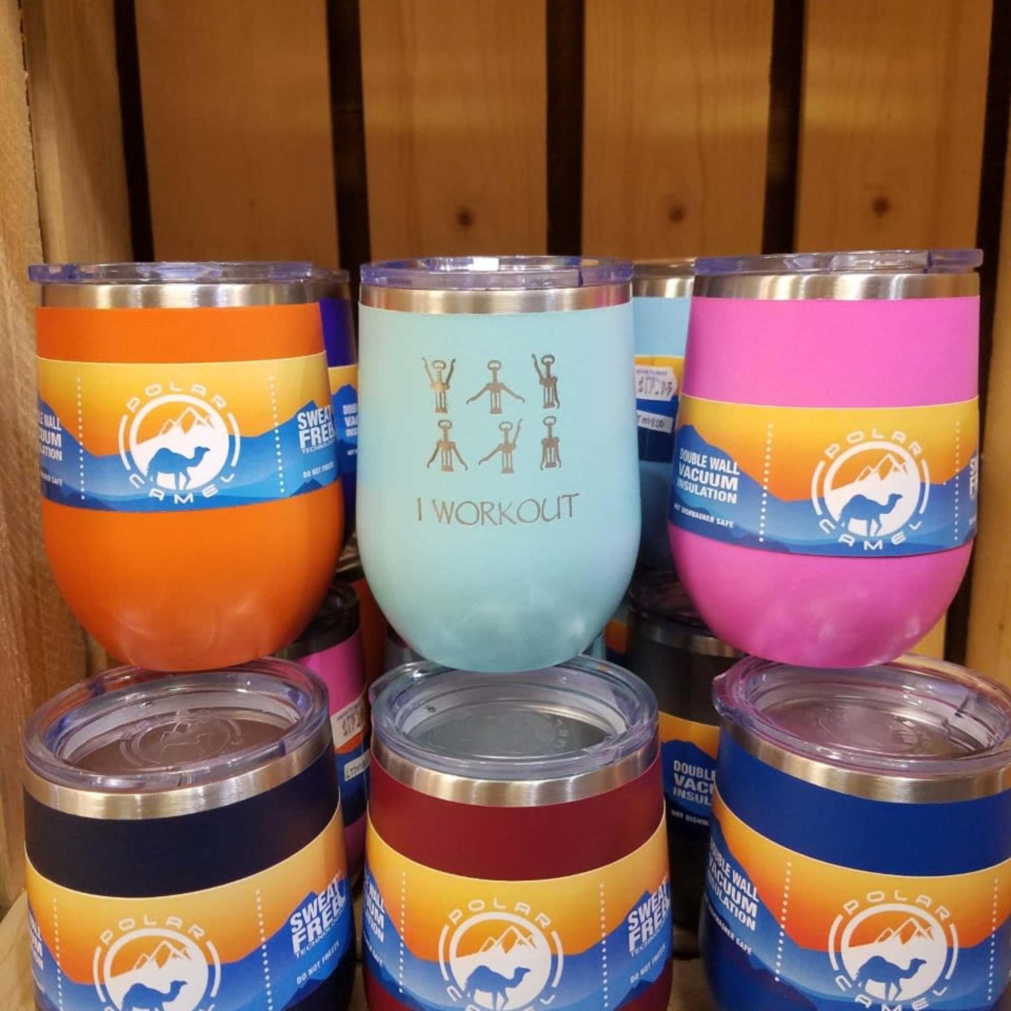 Colorful insulated tumblers stacked on a shelf