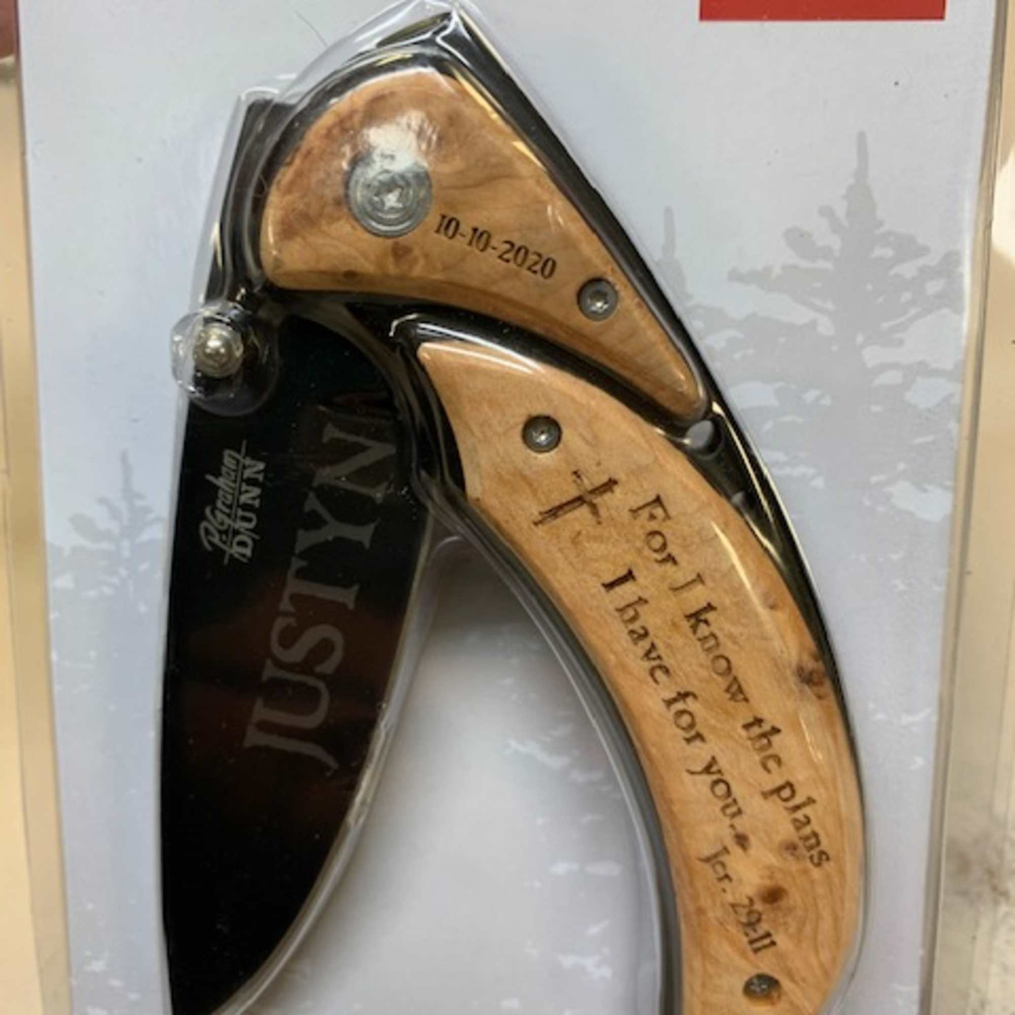 Packaged pocket knife with engraved wooden handle
