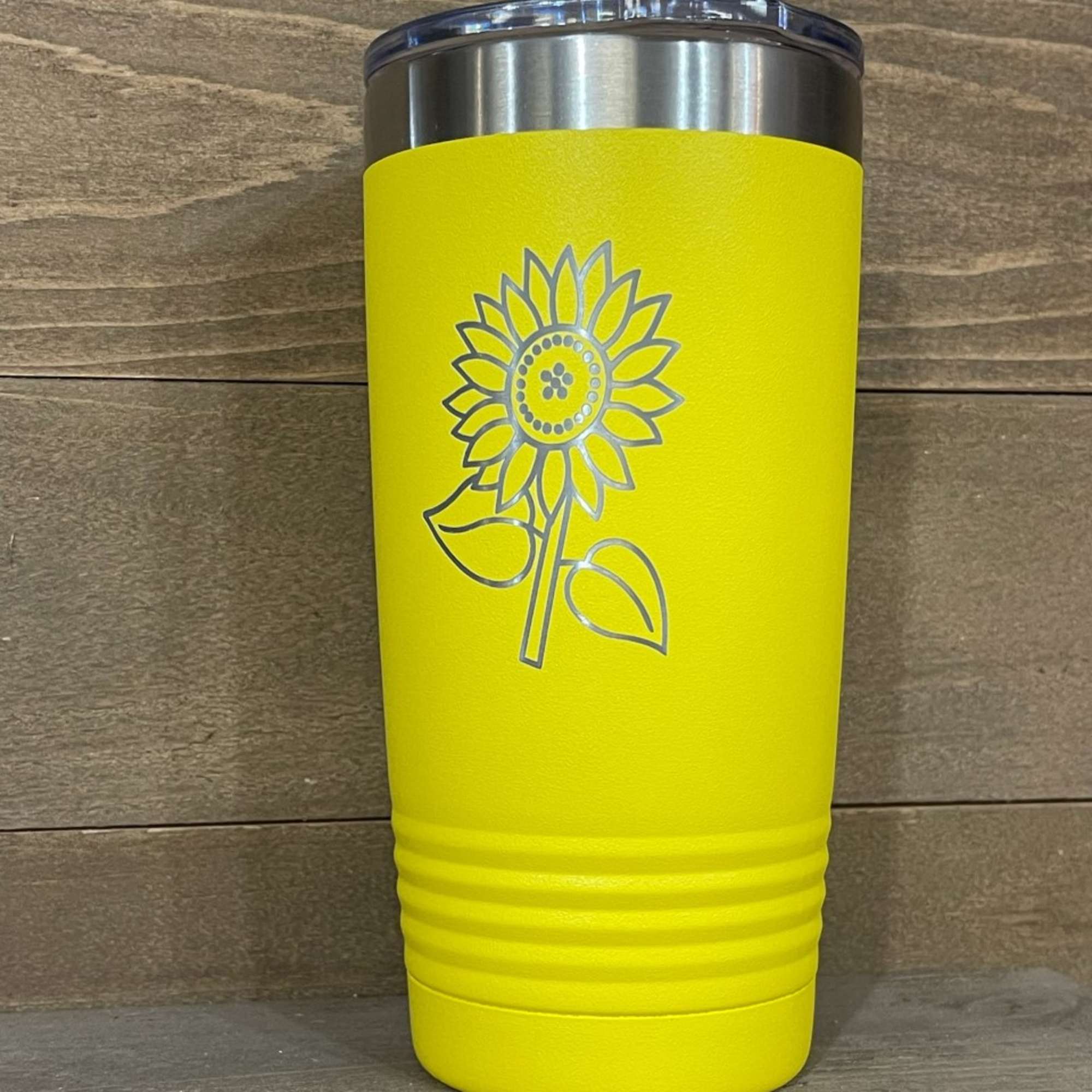 Yellow insulated tumbler with a sunflower design