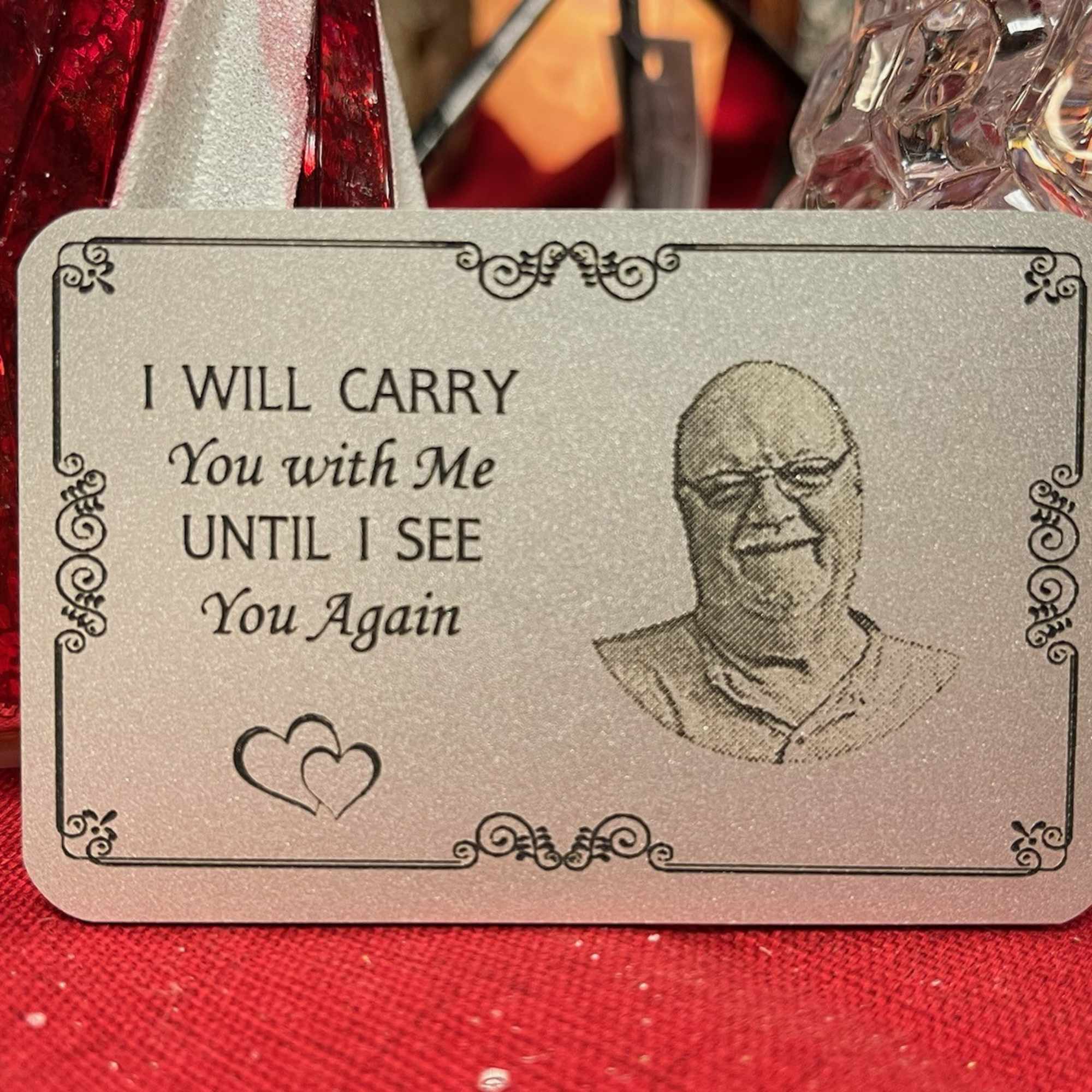 Memorial card with a portrait and the words "I will carry you with me"