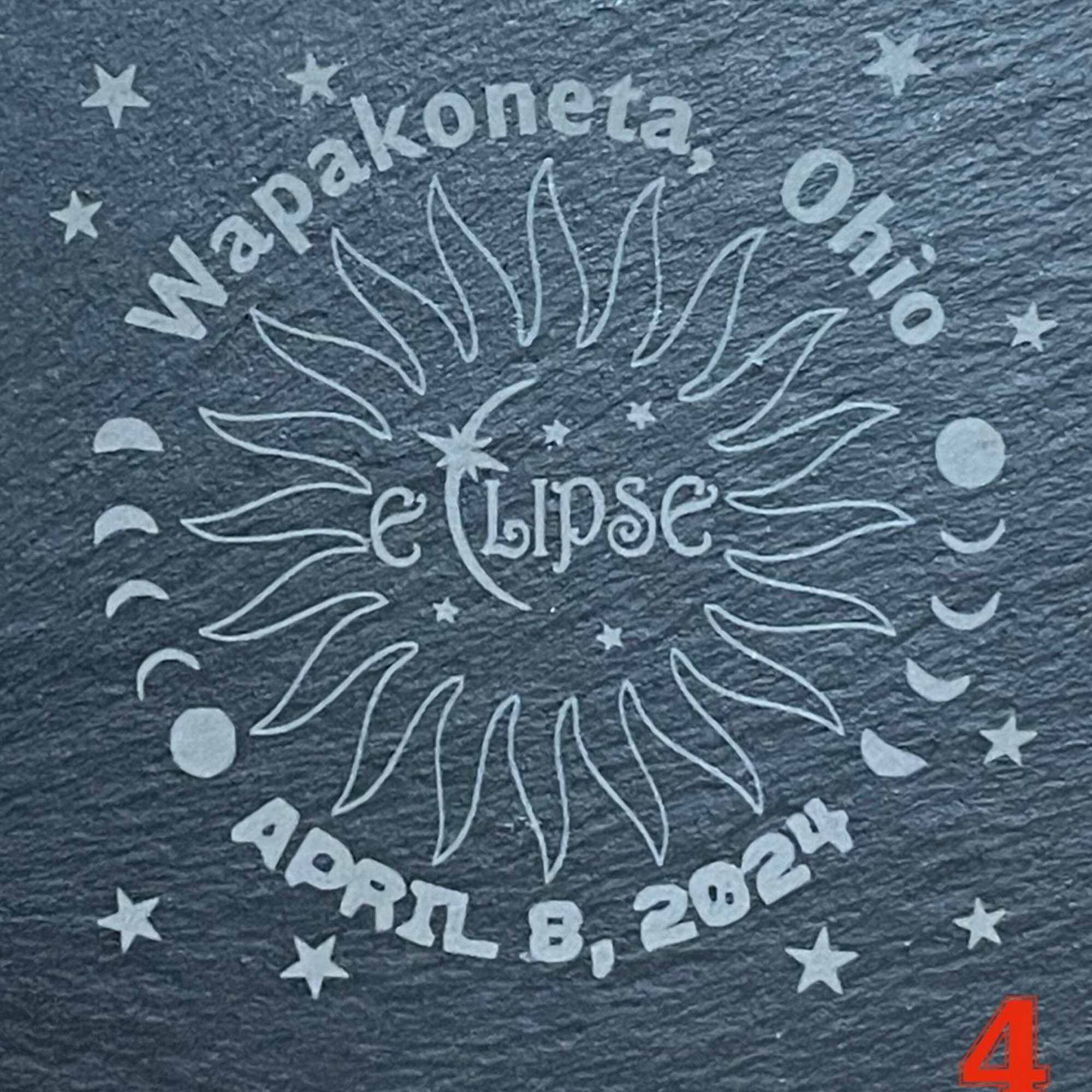 Text graphic reading "Napakonta Ohio Eclipse April 8, 2024" with sun and moon symbols