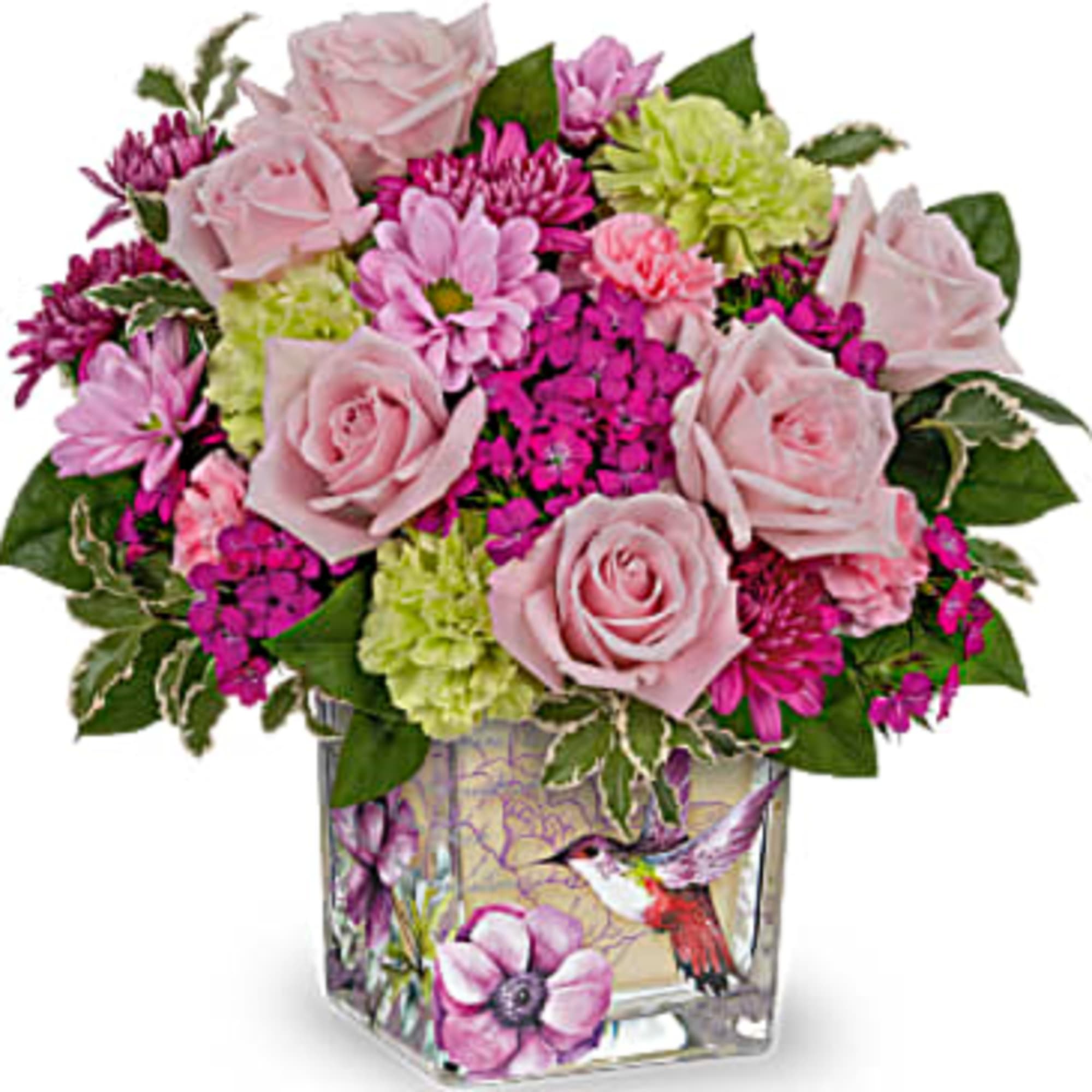 Pink roses and mixed blooms in a square glass vase with a hummingbird design