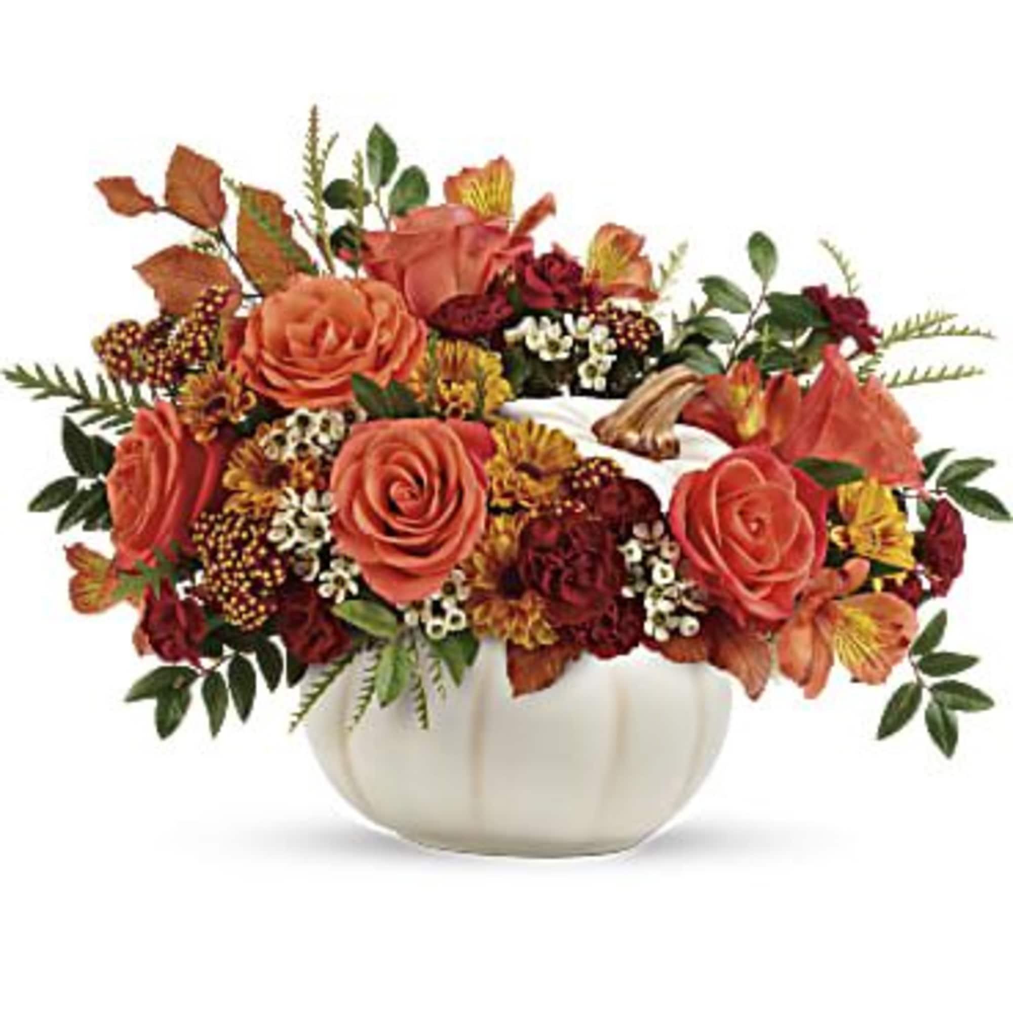 Autumn floral arrangement in a white pumpkin-shaped vase