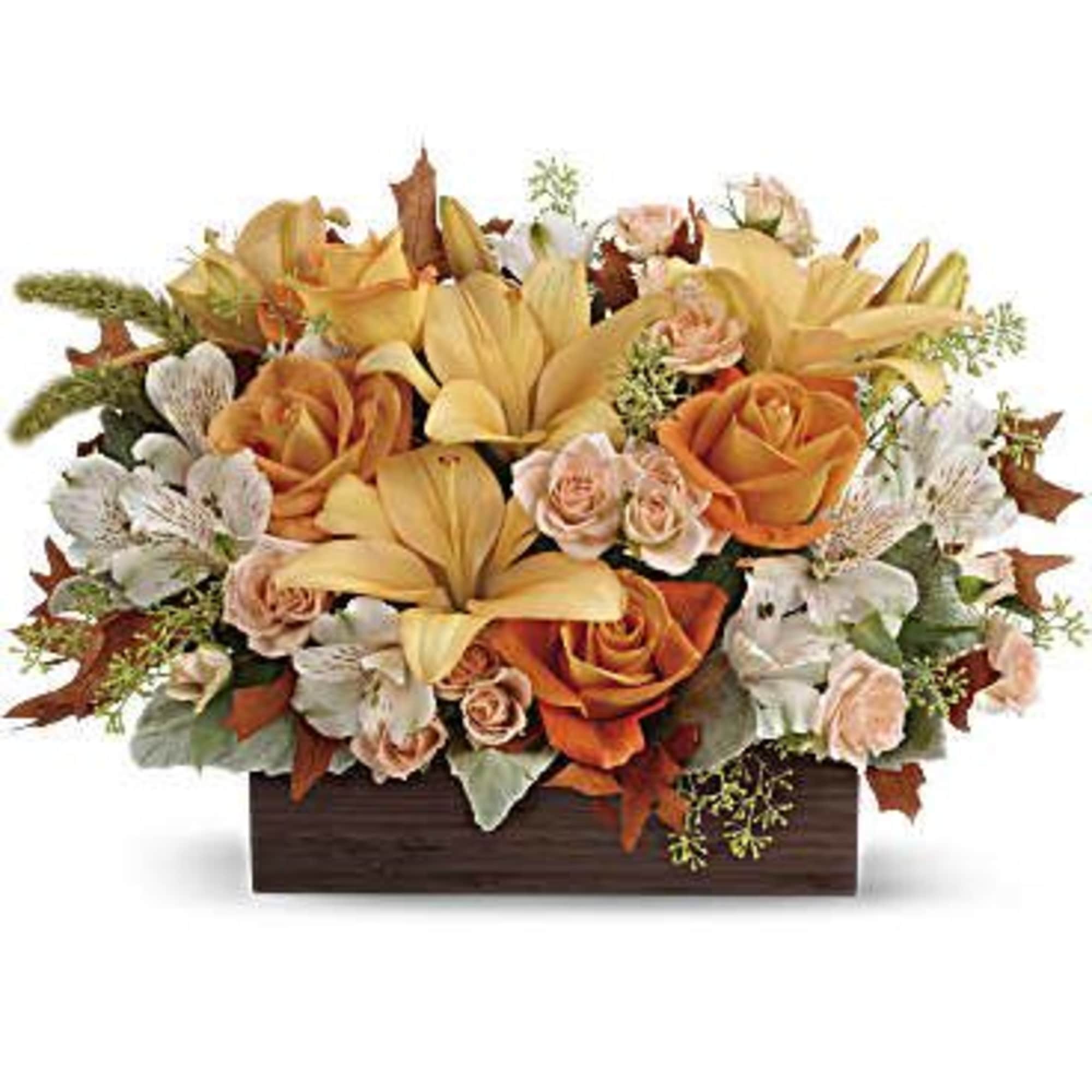 Orange and peach floral arrangement in a rectangular wooden box