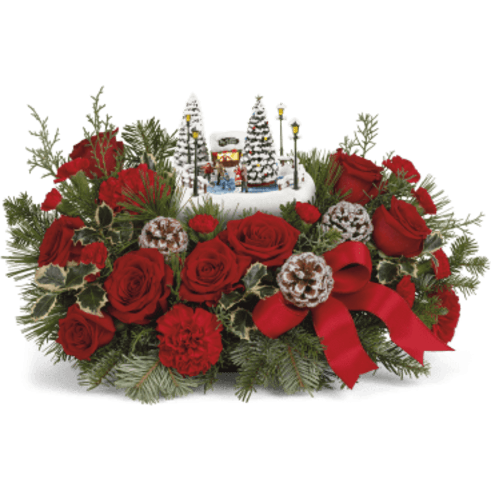 Red roses and carnations around a snowy holiday village centerpiece