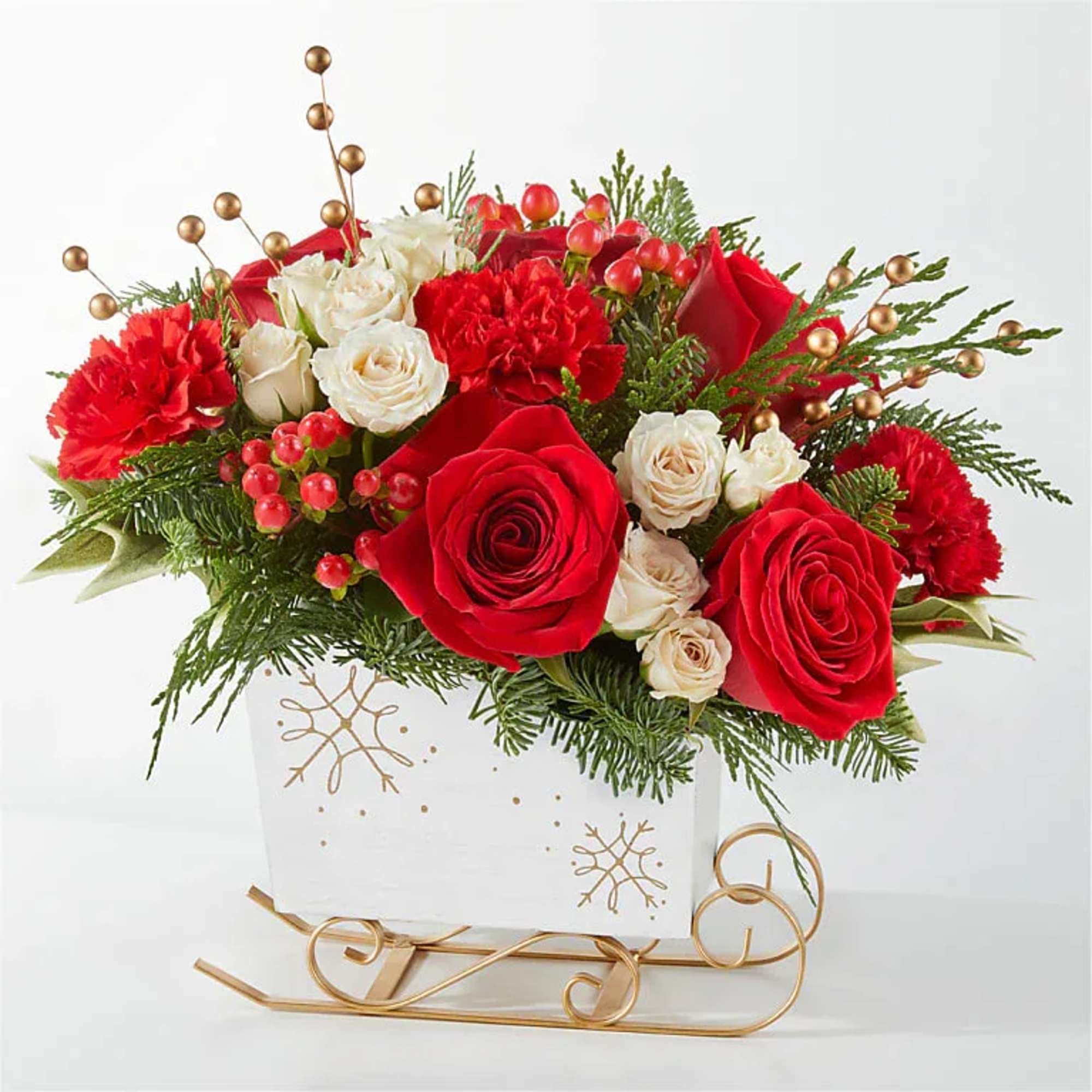 Red and white roses with carnations in a white holiday box